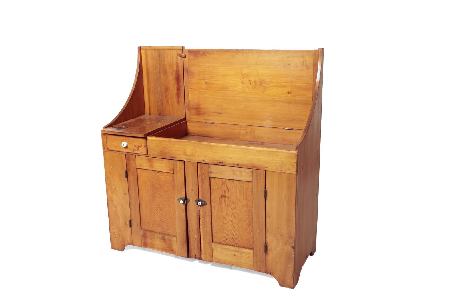 COUNTRY DRY SINK.: COUNTRY DRY SINK. American, 19th Century. Pine. Curved sides, backsplash on one stationary work section over short overlapping drawer, flip top opening to a shallow well, all over two paneled doors