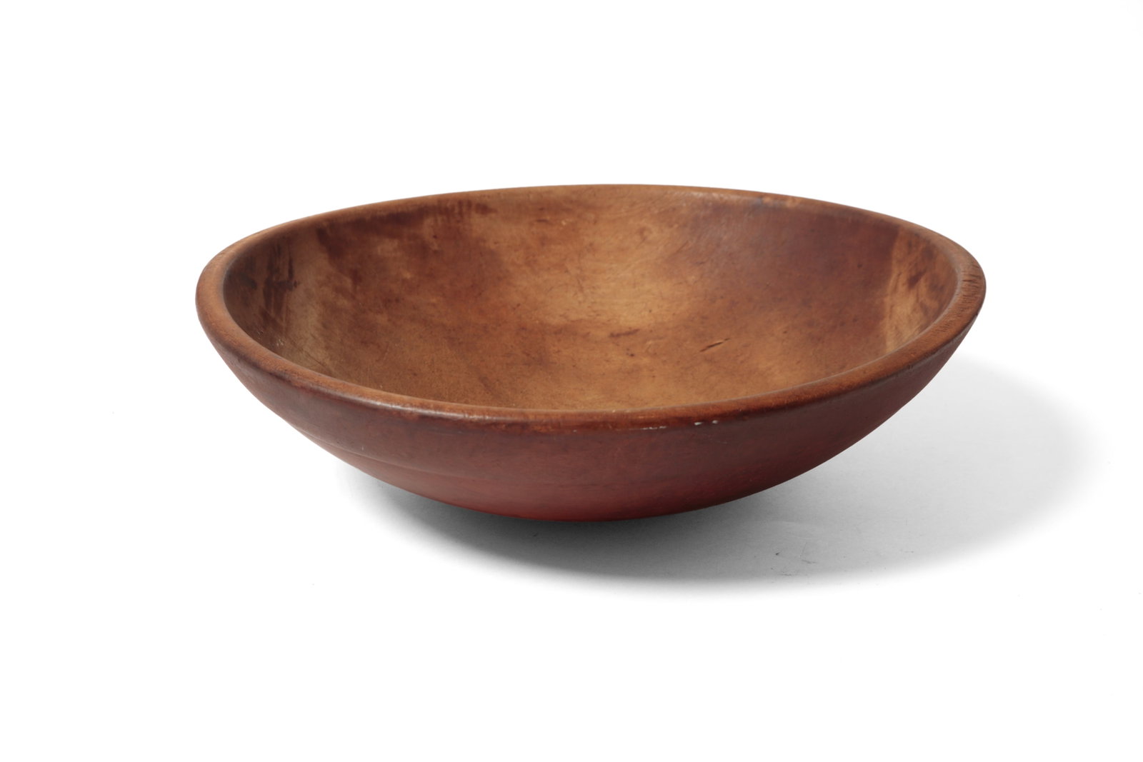 LARGE PAINTED TURNED BOWL.: LARGE PAINTED TURNED BOWL. American, 19th Century. Large bowl, slightly out of round, with a slightly pronounced lip and in a deep red paint. 4.25"h. 16.25"w. Provenance: Nancy Goff (Alliance, Ohio).