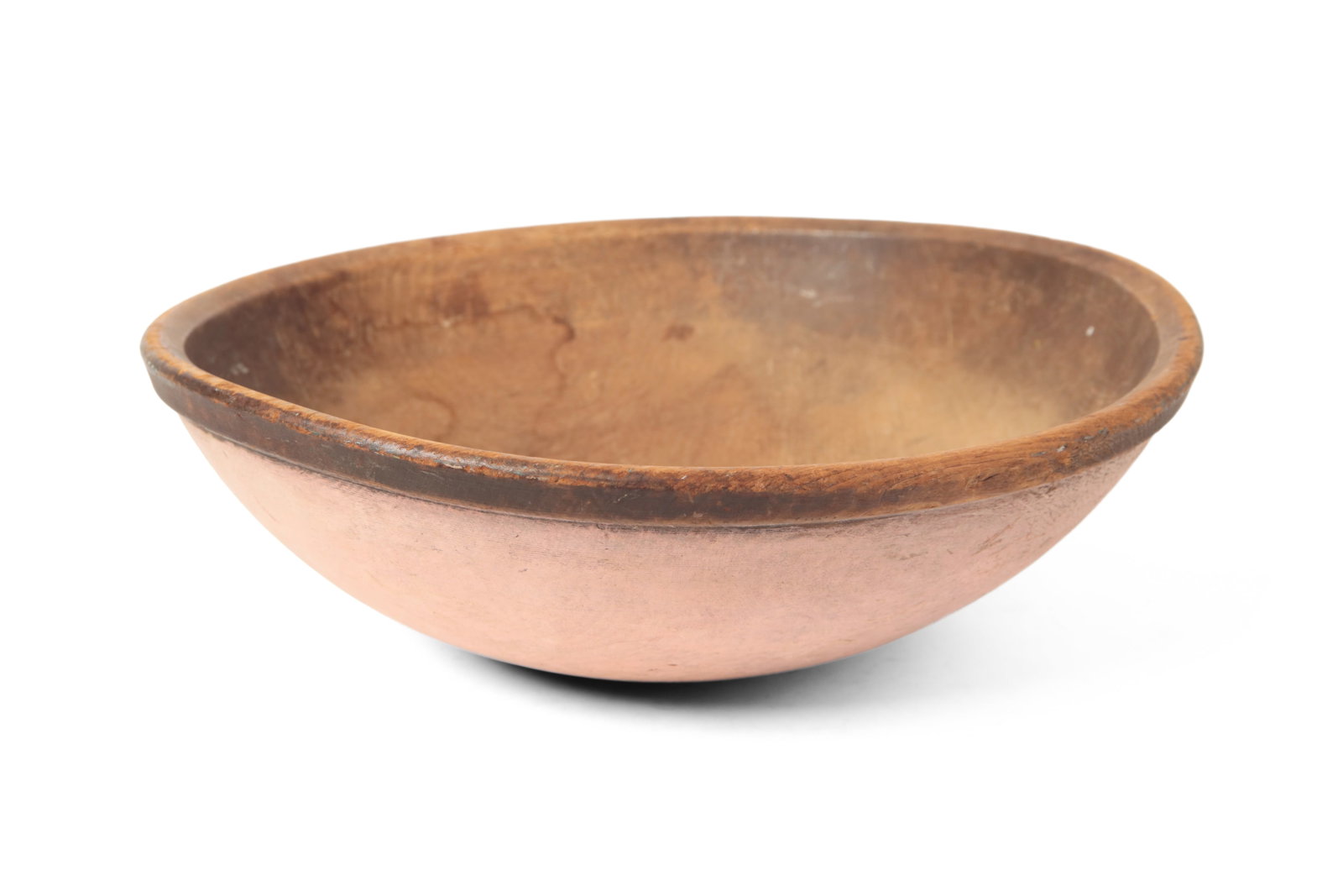 LARGE PAINTED TURNED BOWL.: LARGE PAINTED TURNED BOWL. American, 19th Century. Pine. Large bowl, slightly out of round, with an incised band and in a vibrant later pink paint. 6"h. 18.5"w. Provenance: Nancy Goff (Alliance,