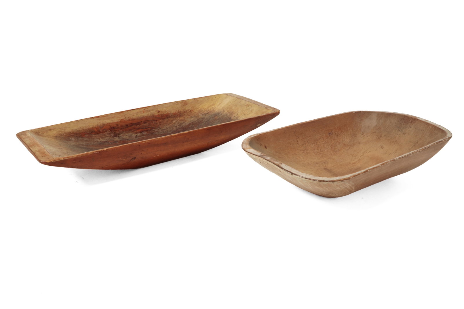 TWO PAINTED AND CARVED WOODEN TRENCHERS.: TWO PAINTED AND CARVED WOODEN TRENCHERS. American, 19th Century. The larger hand-carved pine of rectangular form, the interior with original cream casein paint, the exterior with bittersweet, stamped