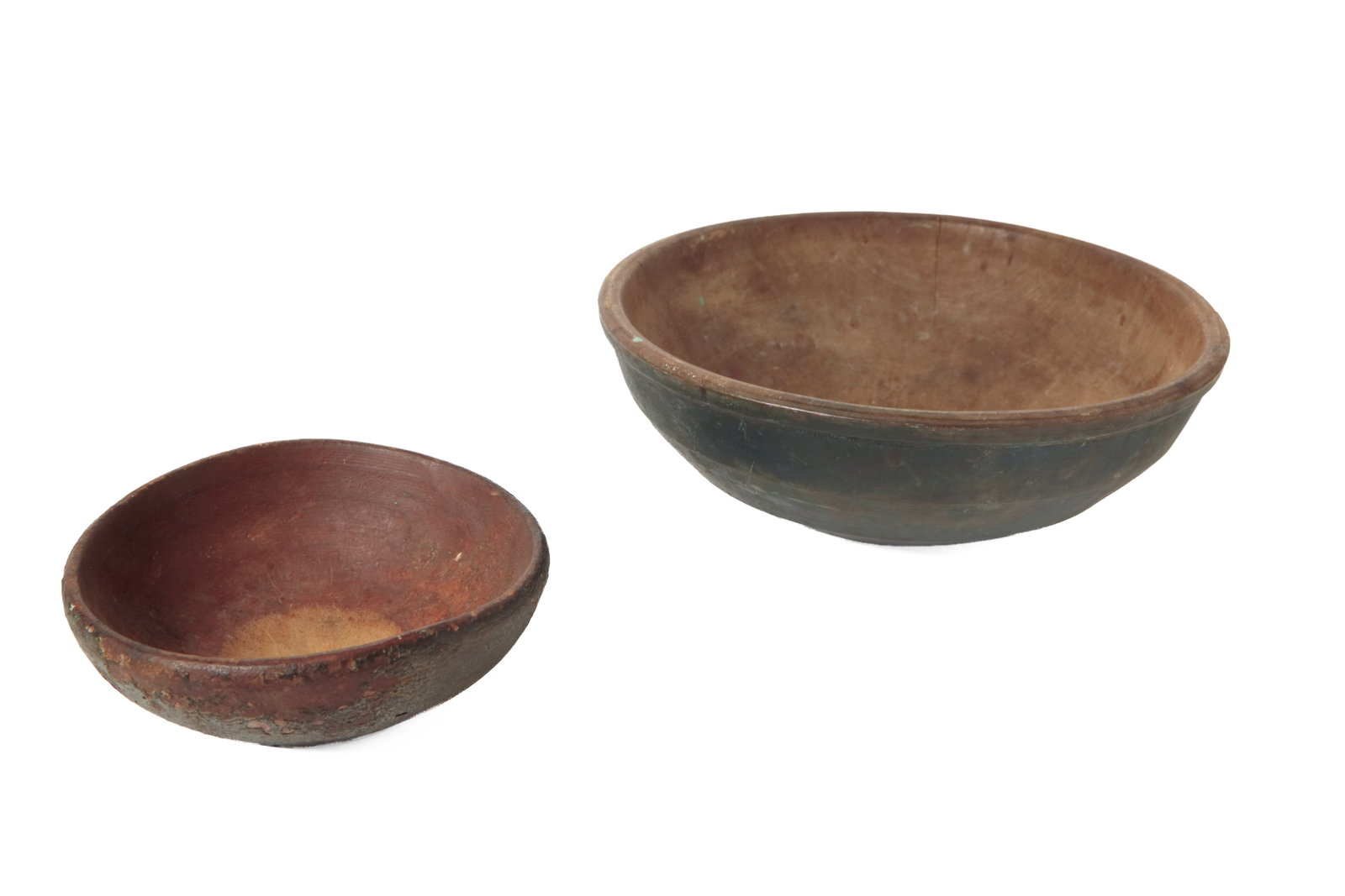 TWO TURNED AND PAINTED WOOD BOWLS.: TWO TURNED AND PAINTED WOOD BOWLS. American, 19th Century. The larger bowl with an exterior painted in blue. 4.25"h. 13"w. The smaller bowl painted in black over red. 2.5"h. 7.75"d.