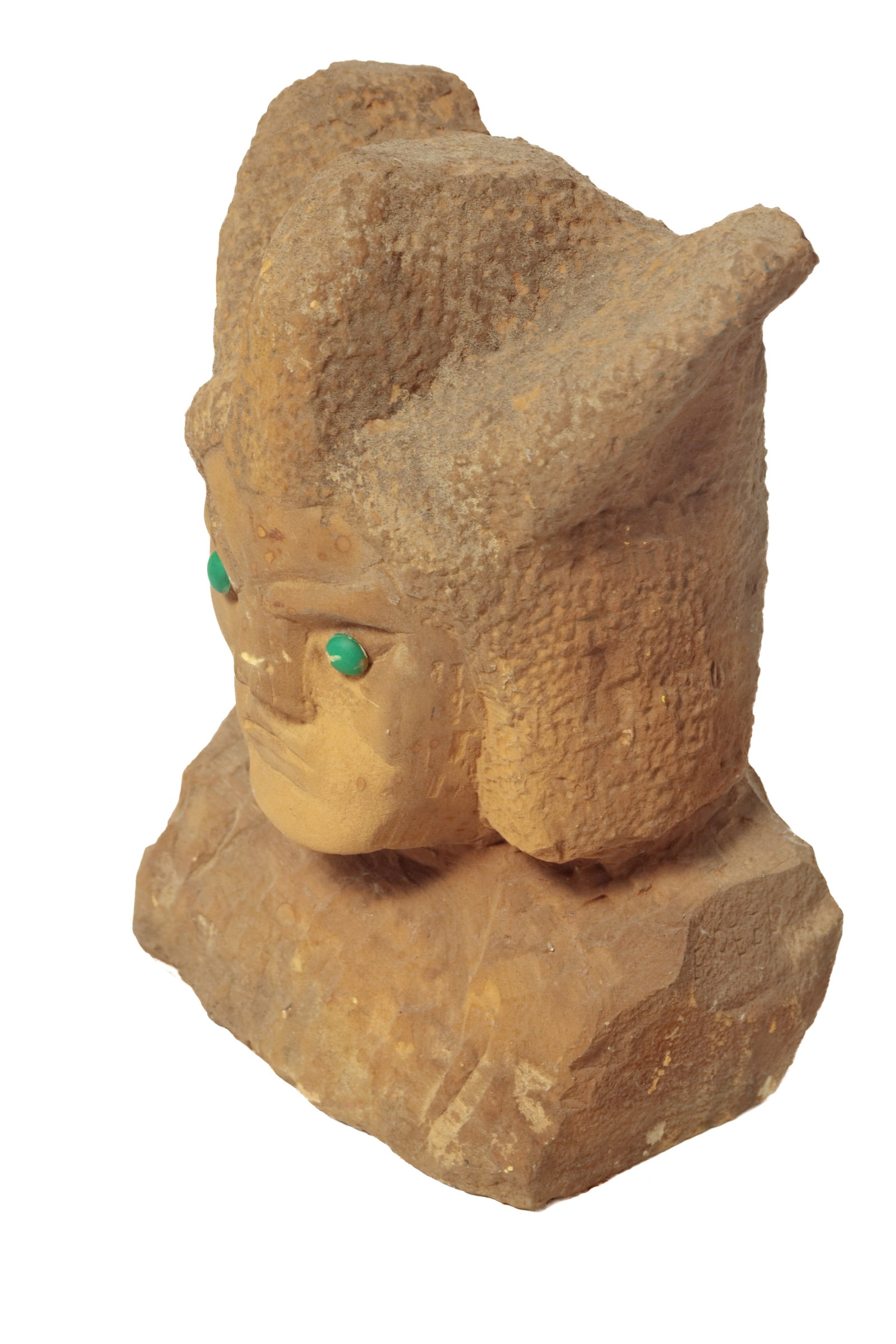ERNEST "POPEYE" REED (OHIO, 1919-1985) FOLK ART CARVED STONE WITCH DOCTOR BUST SCULPTURE.: ERNEST "POPEYE" REED (OHIO, 1919-1985) FOLK ART CARVED STONE WITCH DOCTOR BUST SCULPTURE. American, 20th Century. Signed to side. Depicts a bust of a man wearing a headdress, green cabochon eyes, and 