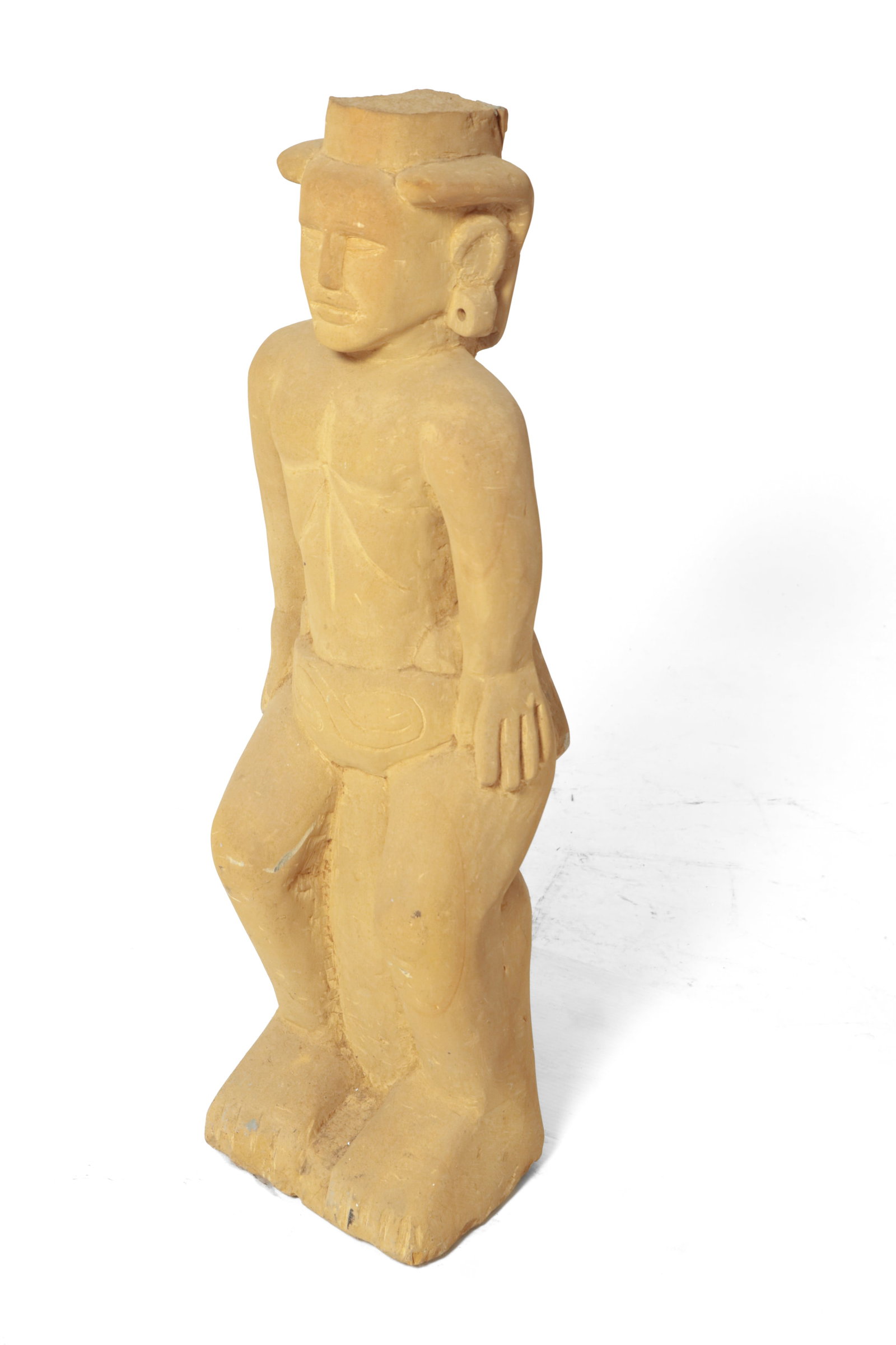 ERNEST "POPEYE" REED (OHIO, 1919-1985) FOLK ART CARVED STONE PRE-COLUMBIAN SCULPTURE.: ERNEST "POPEYE" REED (OHIO, 1919-1985) FOLK ART CARVED STONE PRE-COLUMBIAN SCULPTURE. American, 20th Century. Signed to back. A male figure with bent knees, standing wearing a loincloth and a headdres