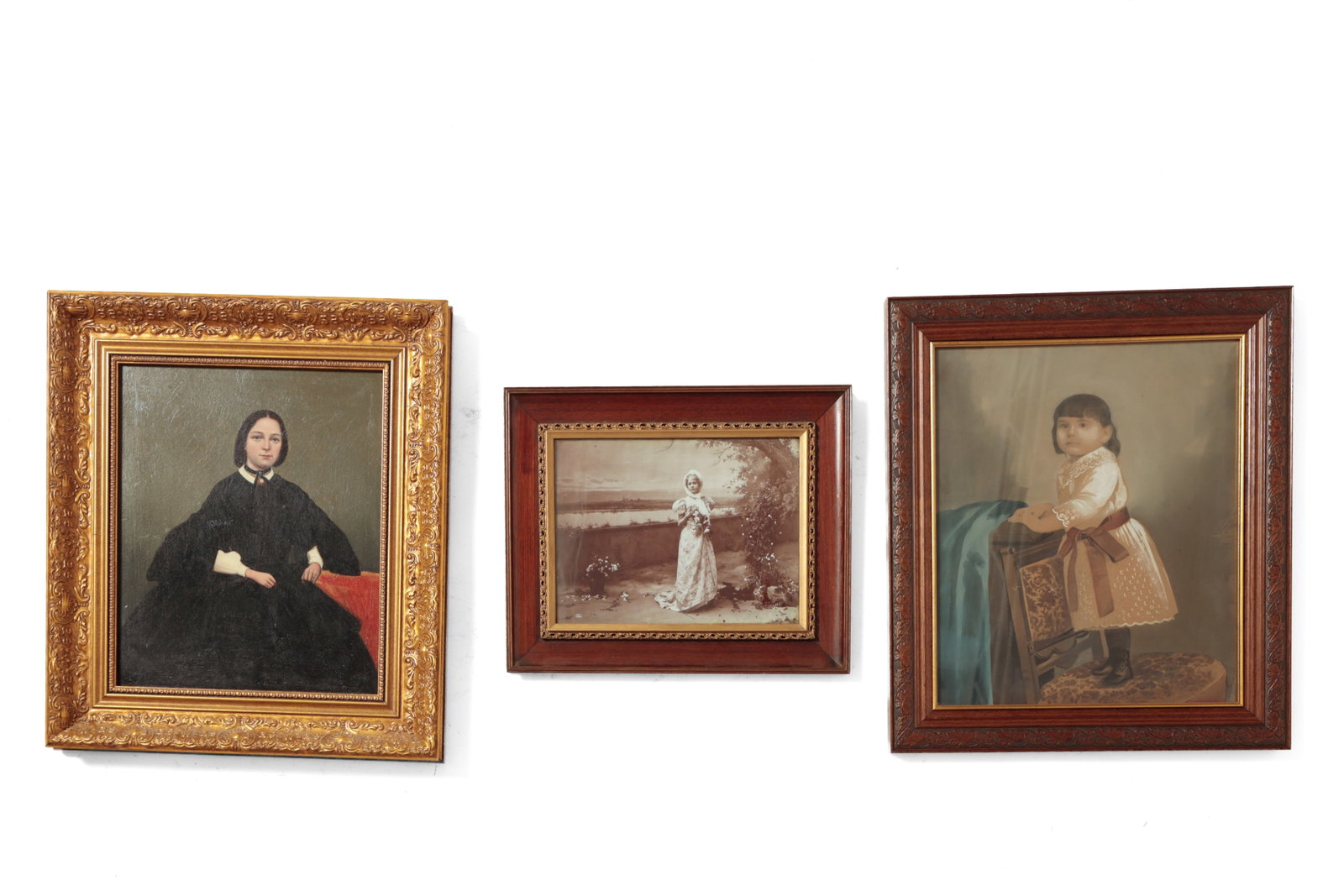 THREE FRAMED PHOTOGRAPHS, TWO EMBELLISHED.: THREE FRAMED PHOTOGRAPHS, TWO EMBELLISHED. American or English, late 19th and early 20th Century. The first a photograph of a woman dressed in black seated on a red sofa, embellished with oil paint, i