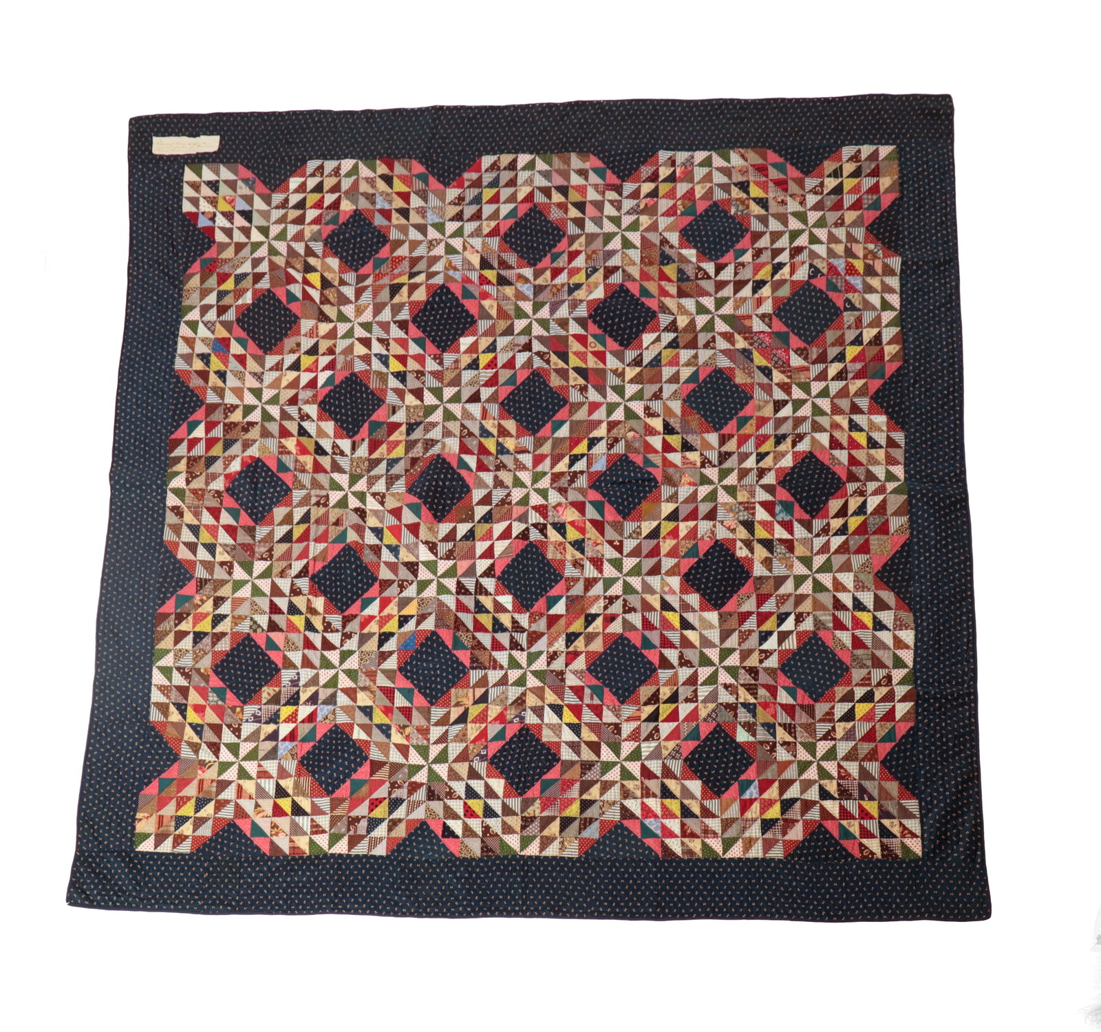 "OCEAN WAVES VARIANT" HAND-STITCHED PIECED COTTON QUILT.: "OCEAN WAVES VARIANT" HAND-STITCHED PIECED COTTON QUILT. American, late 19th Century. Wonderfully quilted, "Ocean Waves Variant" in heavily patterned fabrics, blue patterned border, blue edge