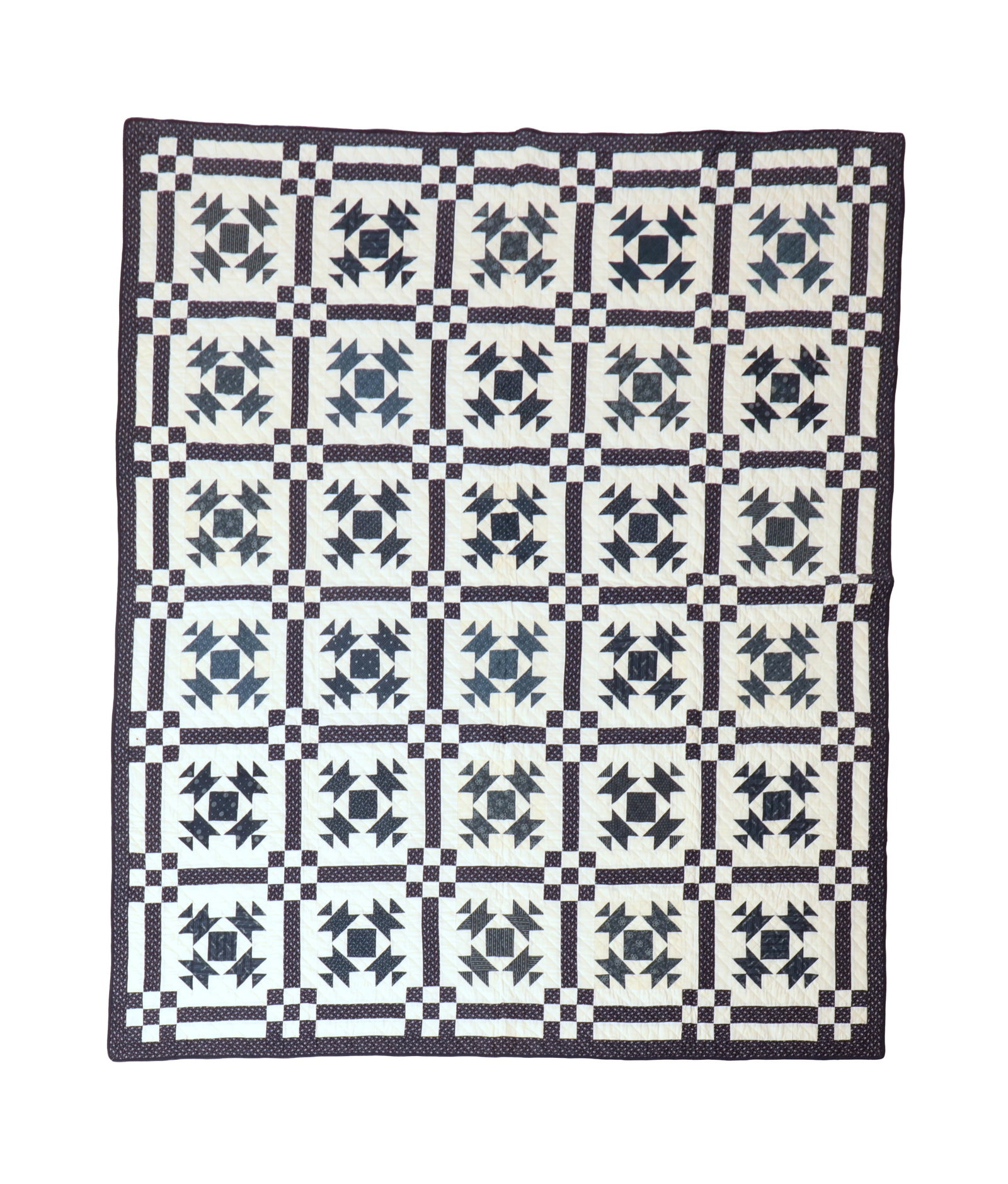 PIECED COTTON QUILT IN "CHURN DASH" OR "MONKEY WRENCH" PATTERN.: PIECED COTTON QUILT IN "CHURN DASH" OR "MONKEY WRENCH" PATTERN. American, 19th Century. Hand-stitched. Having 30 blocks of blue printed and white fabrics within blue printed border and binding. 72"w.