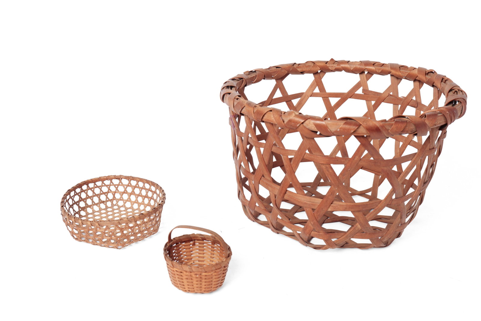 THREE BASKETS WITH WRAPPED RIMS.: THREE BASKETS WITH WRAPPED RIMS. American, early 20th Century. The largest, a tall cheese basket with open bottom and sides, 8.5”h. 13.5”d.; a miniature cheese basket with open sides and