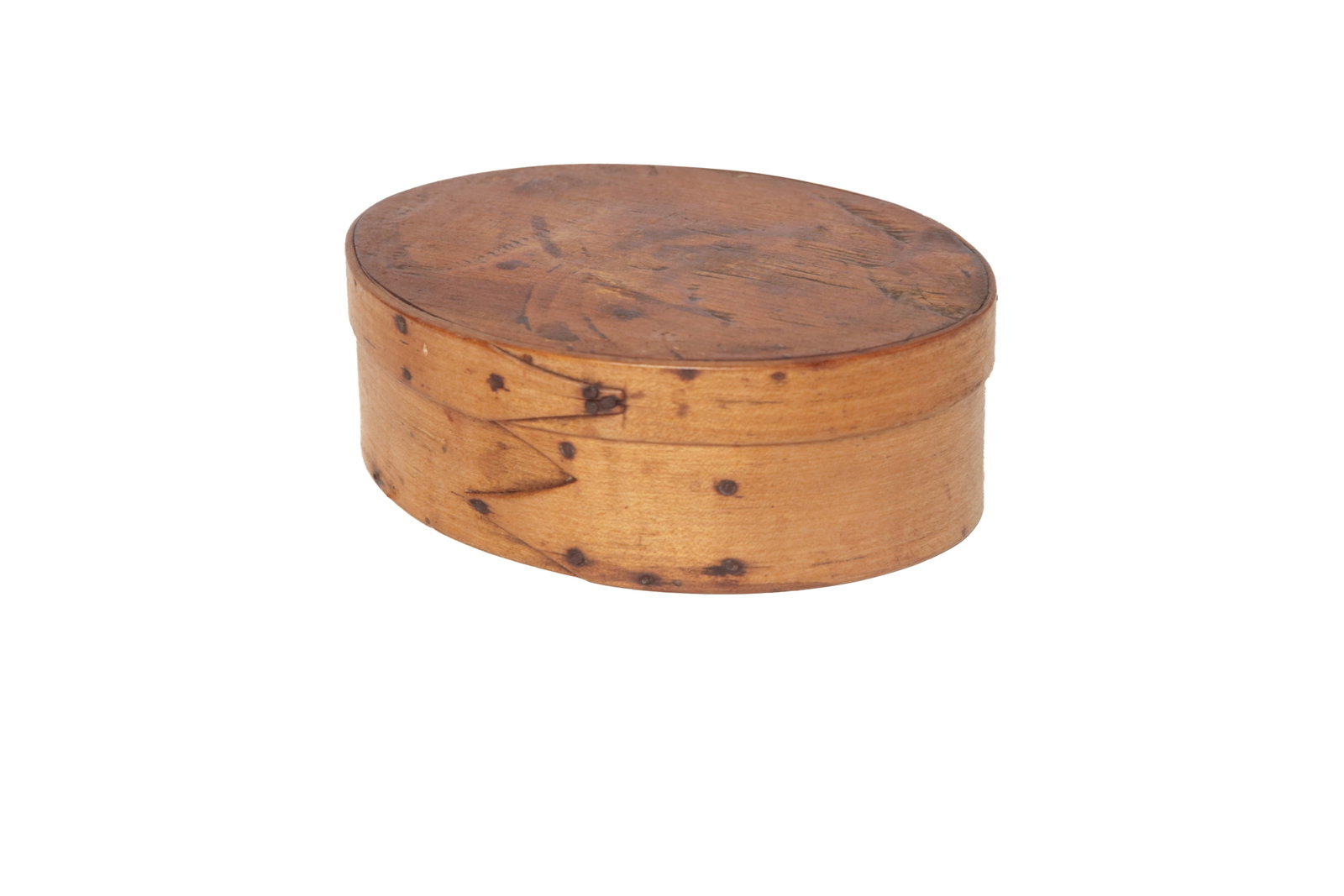 SMALL SHAKER TYPE THREE-FINGER OVAL BENTWOOD PANTRY BOX.: SMALL SHAKER TYPE THREE-FINGER OVAL BENTWOOD PANTRY BOX. American, 19th Century. Maple. Oval form, finger joints with copper tacks. 7.75"l. 6"w. 2.75"h.