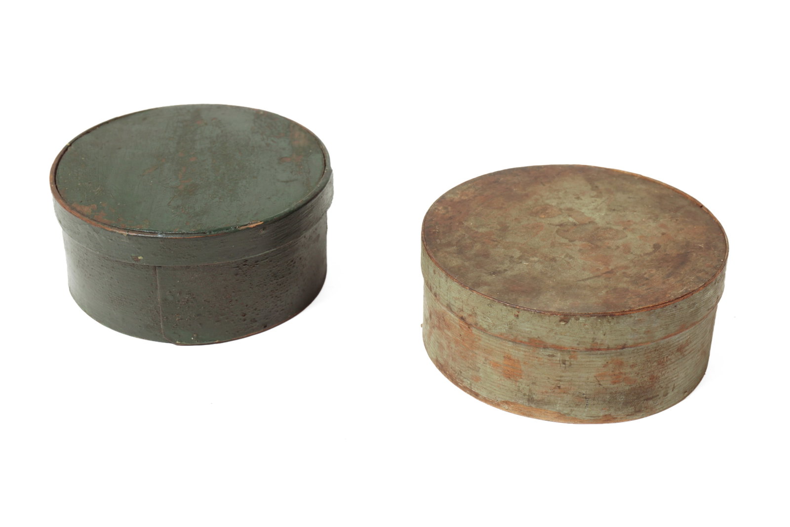 TWO BENTWOOD PANTRY BOXES IN ORIGINAL PAINT.: TWO BENTWOOD PANTRY BOXES IN ORIGINAL PAINT. American, 19th Century. Both having lapped seams with copper tacks. One maple and pine dark Windsor green paint. Ex Pan Ingalls. 3"h. 6.75"d. The other