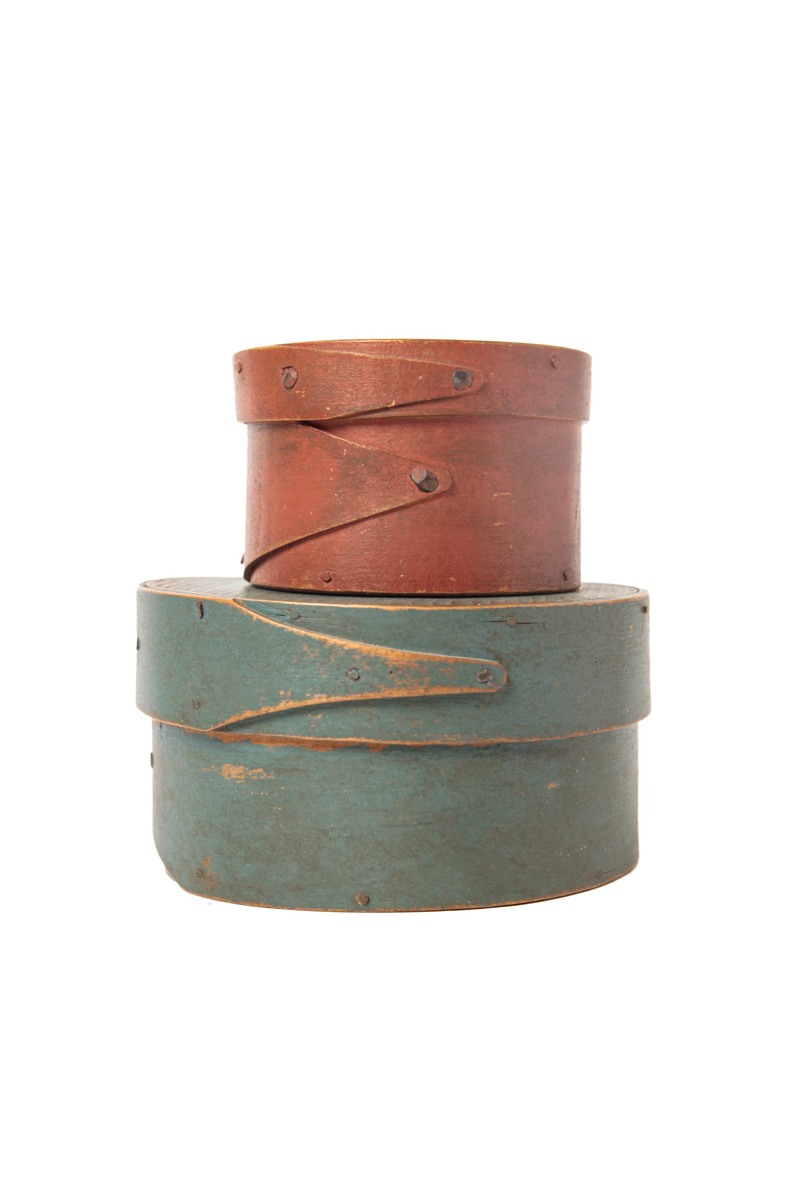 TWO ROUND PANTRY BOXES IN ORIGINAL PAINT.: TWO ROUND PANTRY BOXES IN ORIGINAL PAINT. American, 19th Century. The larger in original blue paint with wood peg and square construction and finger joints, 3"h. 5.25"d. And the second in original