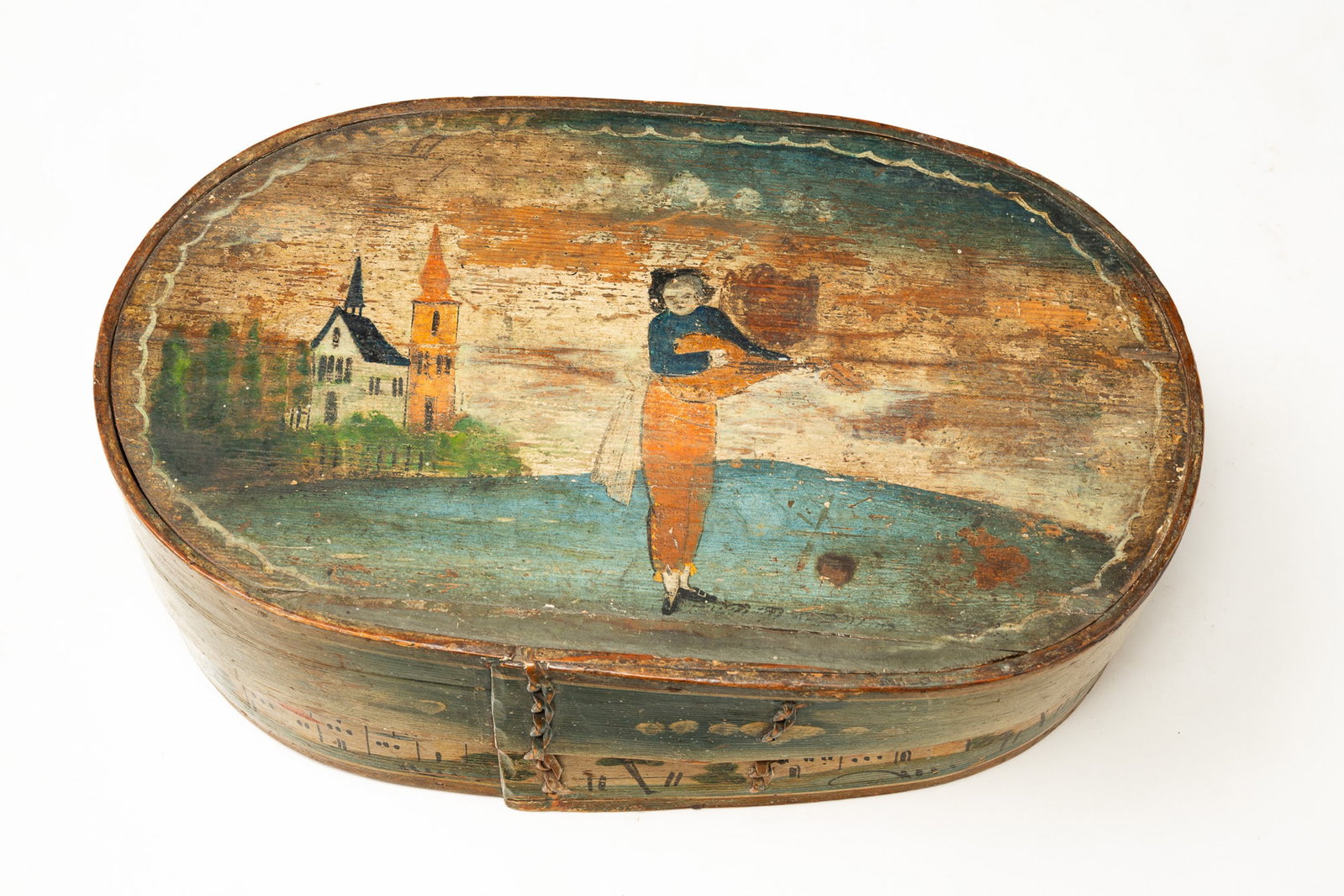 EUROPEAN PAINT-DECORATED BENTWOOD BRIDE'S BOX WITH A LUTE PLAYER AND VILLAGE SCENES.: EUROPEAN PAINT-DECORATED BENTWOOD BRIDE'S BOX WITH A LUTE PLAYER AND VILLAGE SCENES. 19th Century. Oval box with laced seams and original paint decoration, lid shows a musician playing the lute with