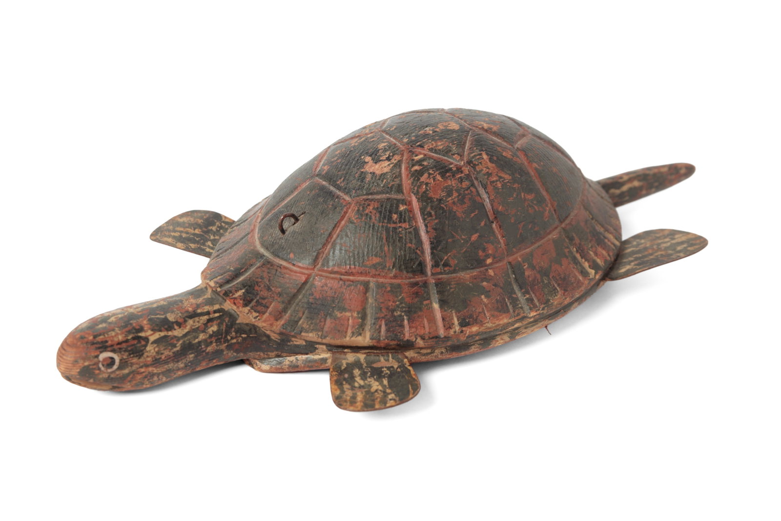 FOLK ART CARVED AND PAINTED TURTLE ICE FISHING DECOY.: FOLK ART CARVED AND PAINTED TURTLE ICE FISHING DECOY. American, 20th Century. Wood and tin. Green and red-painted turtle with a carved shell, head, and tail and tin feet. The underside has an inset le