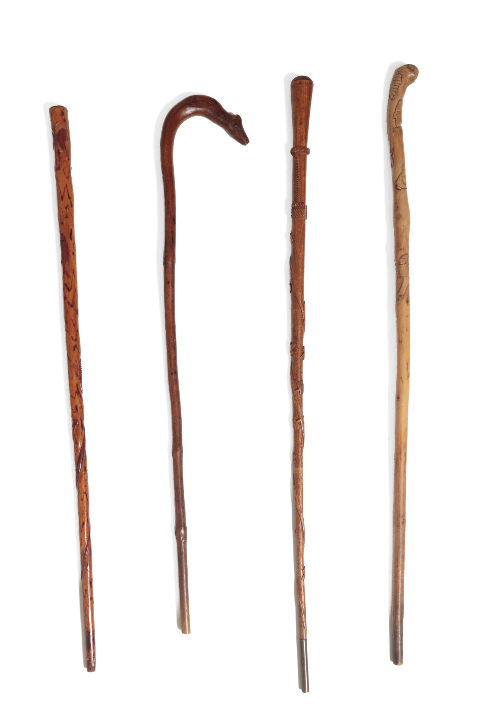 FOUR FOLK ART CARVED CANES OR WALKING STICKS. (1 of 20)