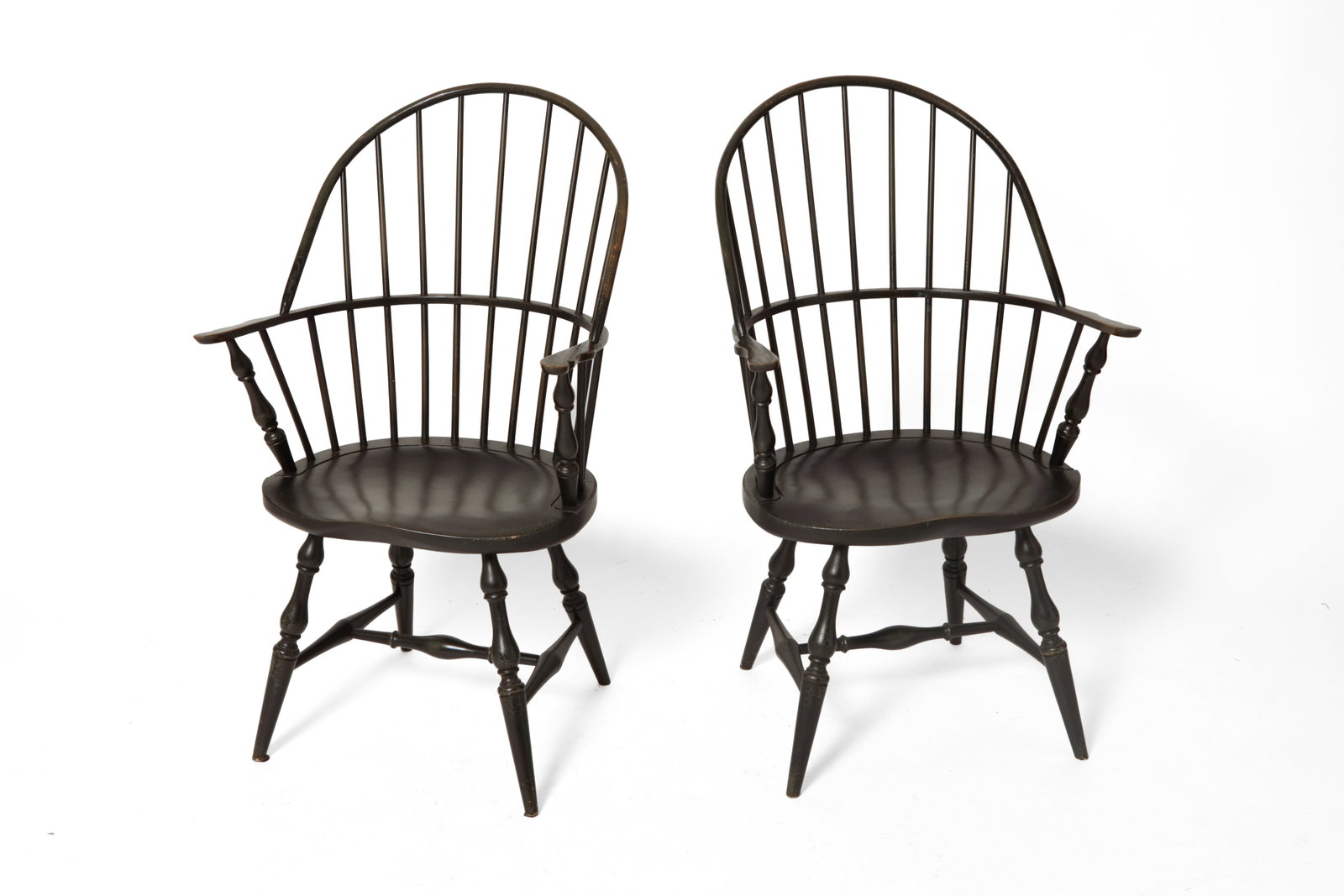 PAIR OF DAVID T. SMITH SACKBACK WINDSOR ARMCHAIRS WITH DISTRESSED DARK GREEN PAINT.: PAIR OF DAVID T. SMITH SACKBACK WINDSOR ARMCHAIRS WITH DISTRESSED DARK GREEN PAINT. American (Morrow, Ohio), late 20th Century. Spindle backs, shaped arms and seats, turned stiles, legs and