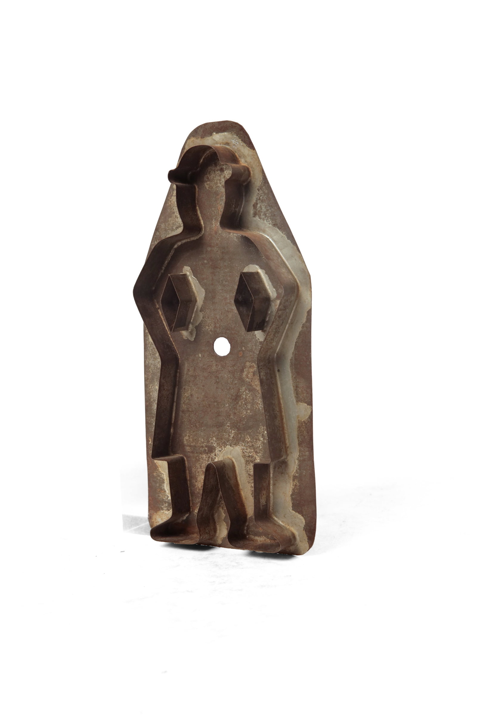 OVERSIZED STANDING MAN COOKIE CUTTER.: OVERSIZED STANDING MAN COOKIE CUTTER. American, 19th Century. A hatted man standing with his arms at his waist, with a flat back and applied strap handle. 11"h. 5"w. Provenance: The Lifetime Collectio