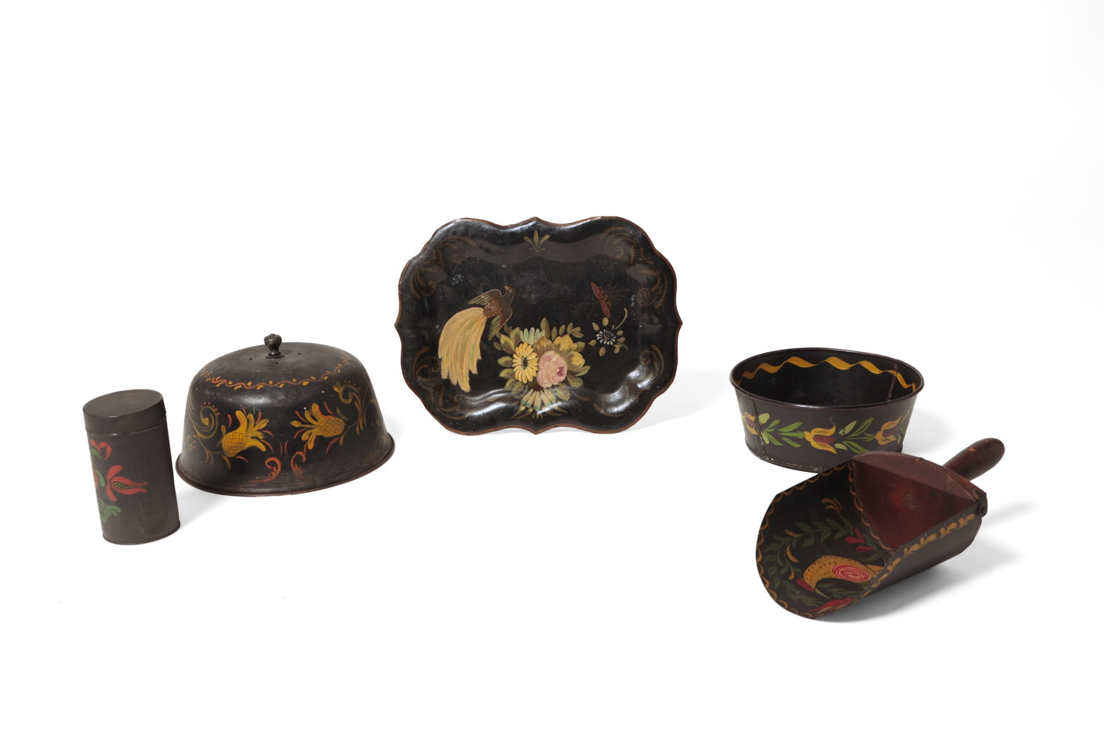 GROUP OF PAINTED TOLEWARE.: GROUP OF PAINTED TOLEWARE. American, late 19th or early 20th Century. A round cheese dome with flowers and decorative flourishes, 6.5"h., a shaped edge tray with a bird and flowers, 14.25"w., a scoop