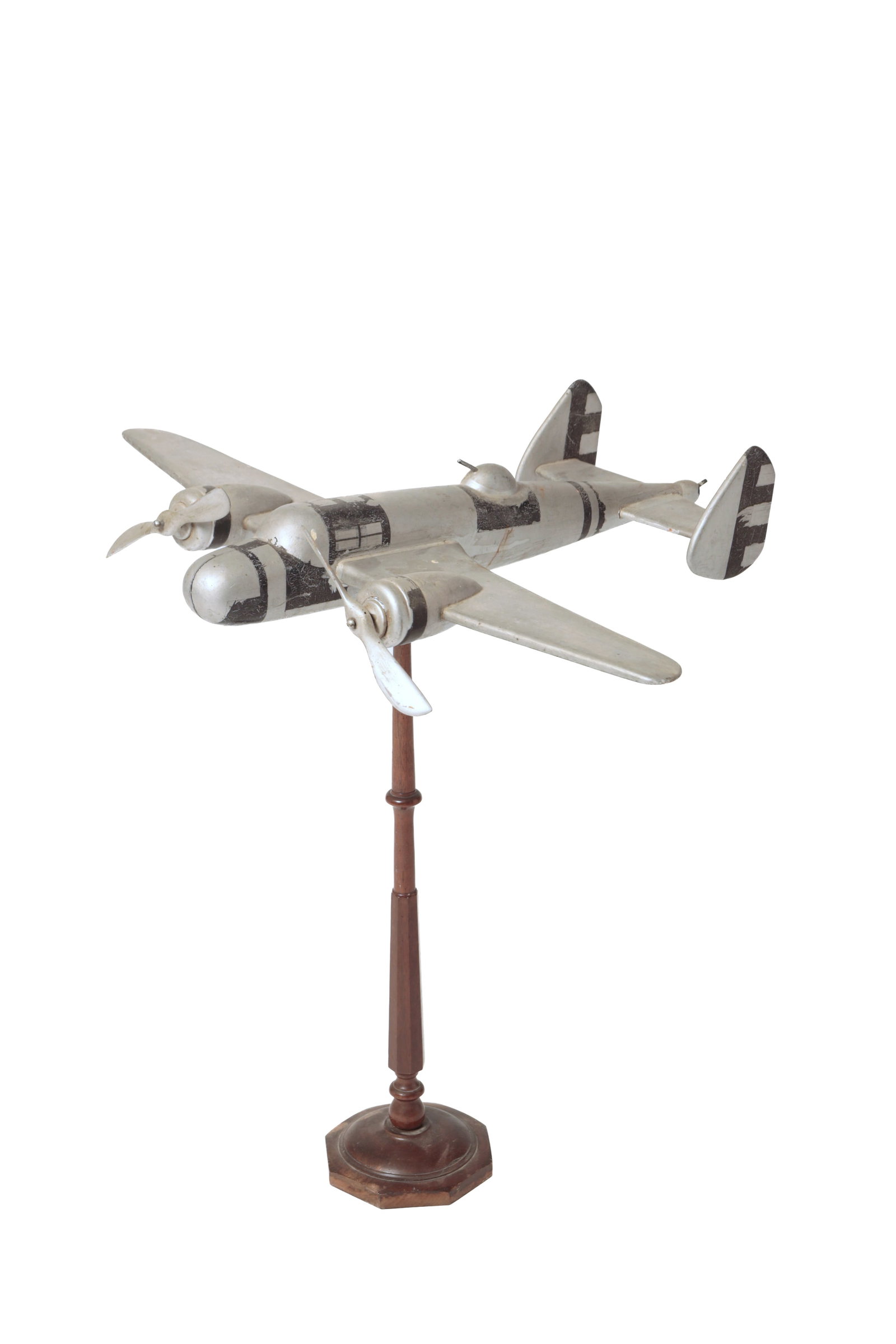 FOLKSY CARVED WWII BOMBER IN SILVER PAINT ON STAND. (1 of 11)