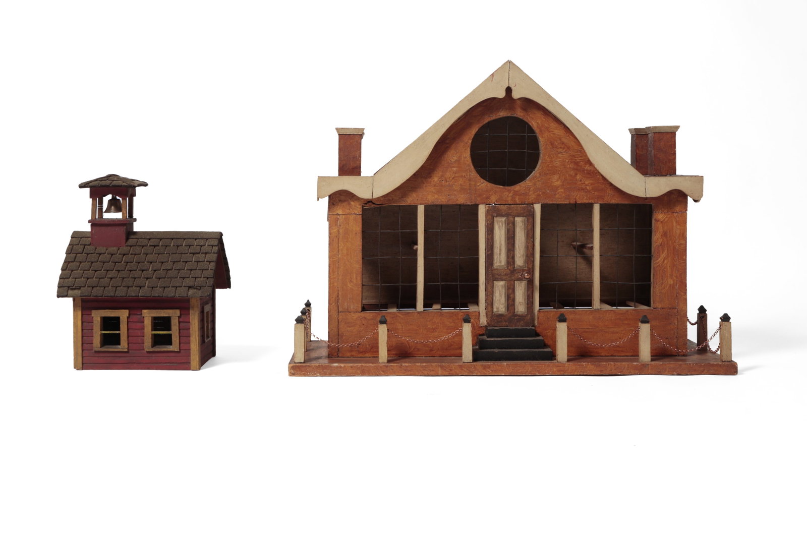 TWO FOLKSY BIRD HOUSES.: TWO FOLKSY BIRD HOUSES. American, early 20th Century. A large house-form birdhouse with a peaked roof, round window to top from, shaped gables, window front, arched windows on either end, tree-step po