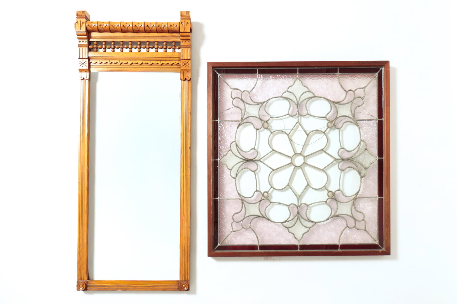 VICTORIAN PIER MIRROR AND LEADED GLASS WINDOW PANEL.: VICTORIAN PIER MIRROR AND LEADED GLASS WINDOW PANEL. American, late 19th Century. Beveled clear glass, medallion center, amethyst and clear pebble glass stylized surround and ruby border. In a pine