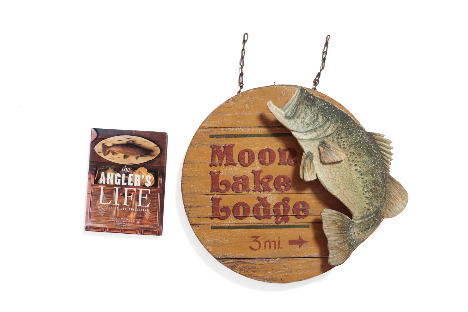 FOLK ART "MOON LAKE LODGE" SIGN.: FOLK ART "MOON LAKE LODGE" SIGN. American, 20th Century. Round wooden sign in yellow paint with red lettering reading "Moon Lake Lodge 3 mi." and an attached three-dimensional paint-decorated fish on