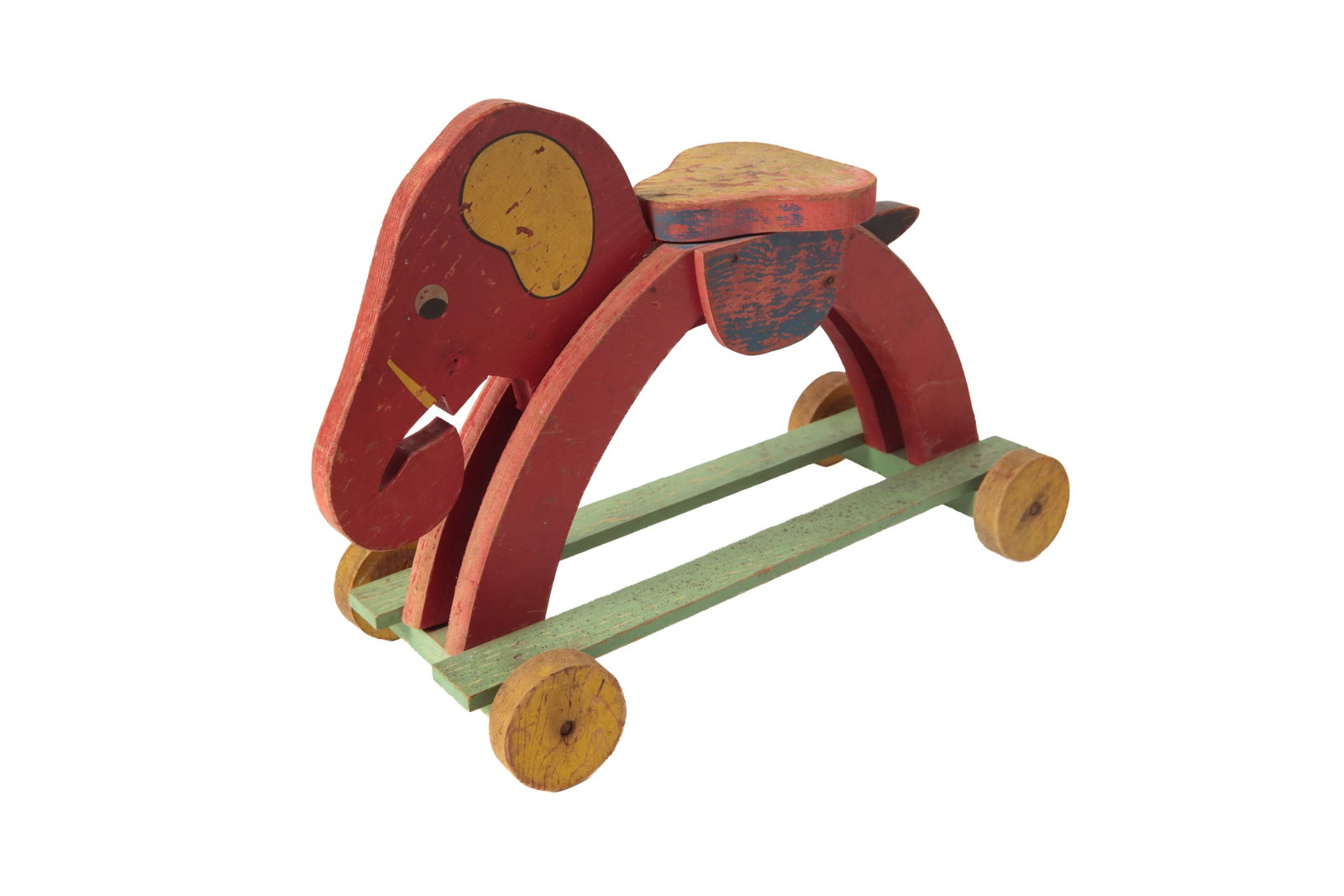 TOY KRAFT CO. (WOOSTER, OHIO) SADDLE ELEPHANT #509 RIDE ON TOY.: TOY KRAFT CO. (WOOSTER, OHIO) SADDLE ELEPHANT #509 RIDE ON TOY. American, 20th Century (1930s). Polychrome painted wood with shaped seat, elephant head, tail, half circle legs, runners, and four
