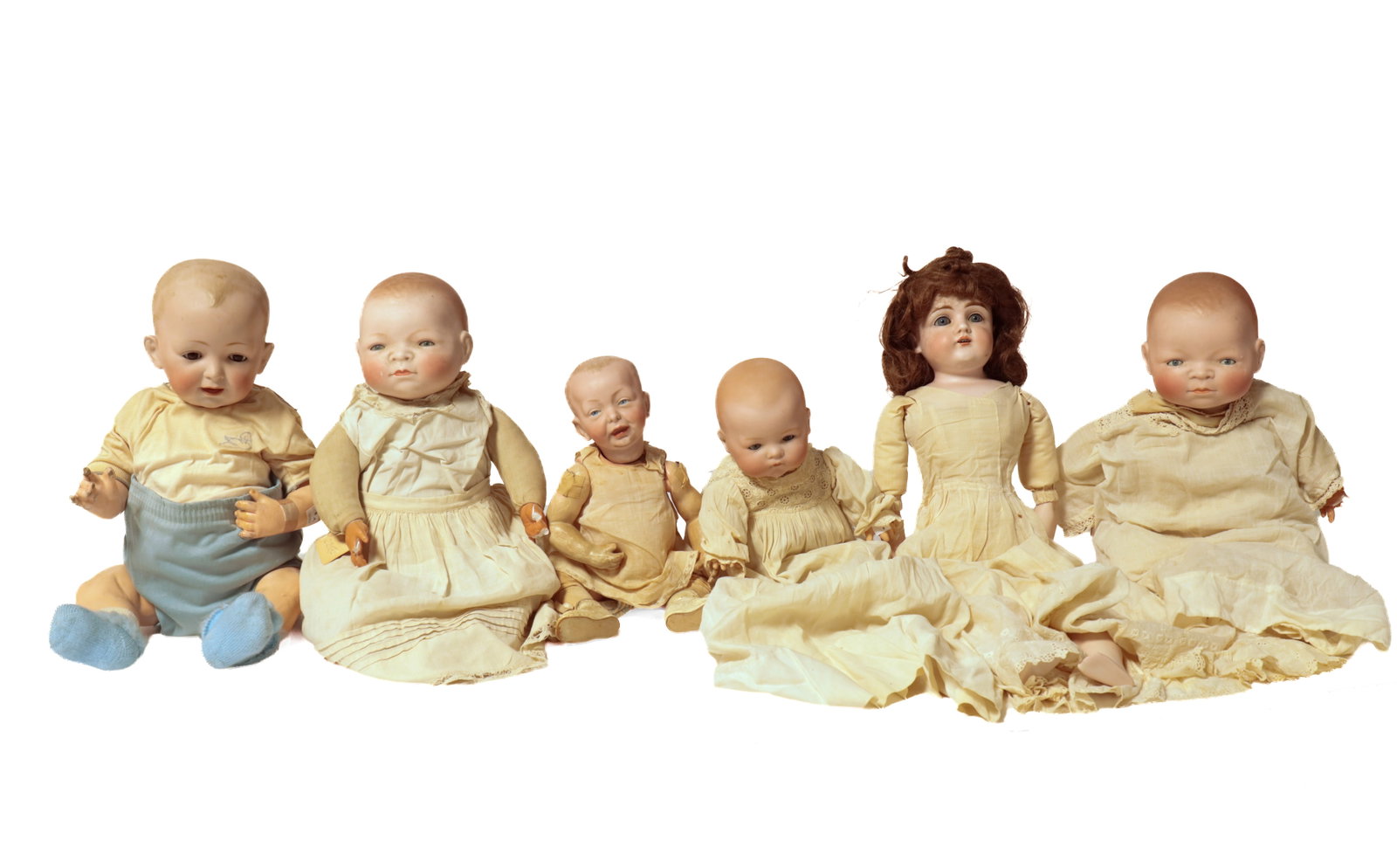 SIX BISQUE HEAD DOLLS. (1 of 8)
