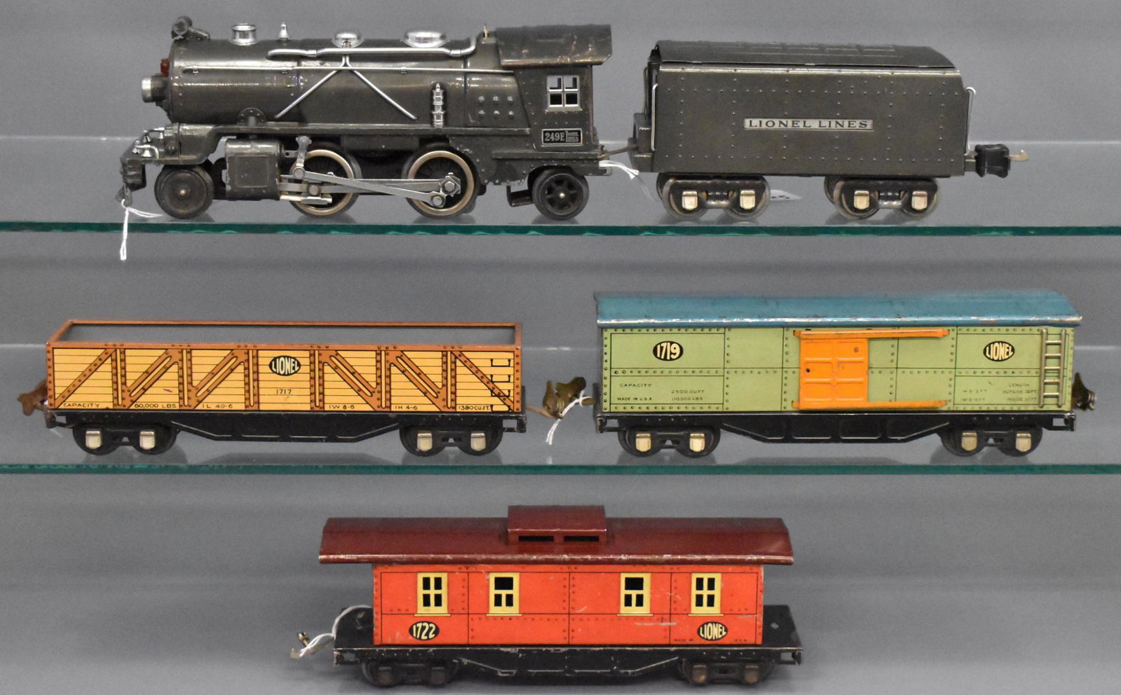 Lionel prewar O gauge steam freight set with tin: Set consists of 249E steam locomotive and 265T in gunmetal, 1717 gondola, 1719 box car and 1722 caboose, C5-6.