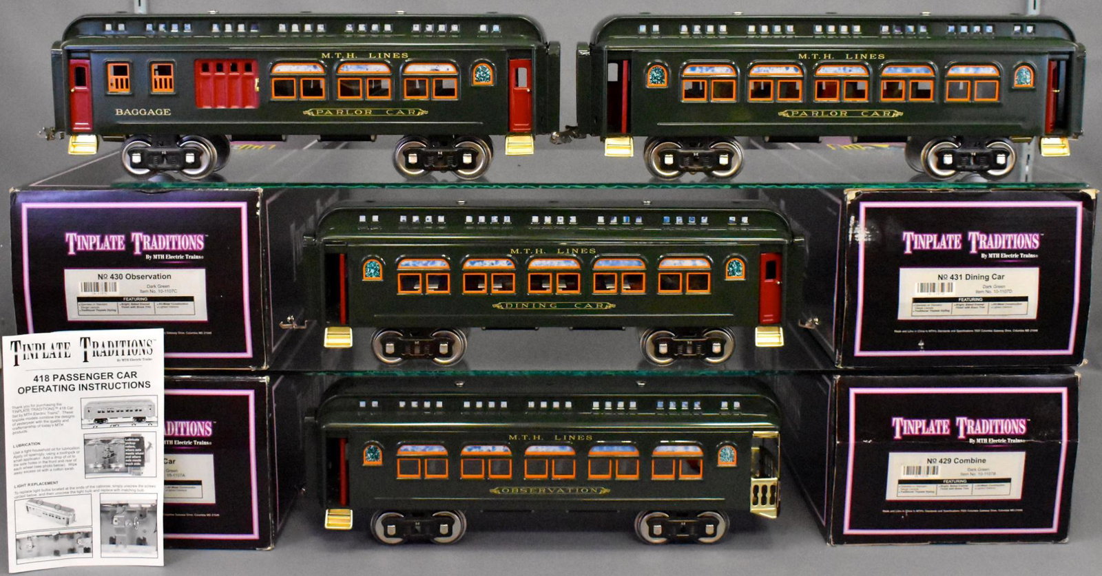 MTH Tinplate traditions Lionel Standard gauge passenger: Set is all dark green with orange window trim and includes 428 parlor, 429 combine, 430 observation and 431 dining cars, all are unrun but have been displayed and may have dust or need a detail cleani