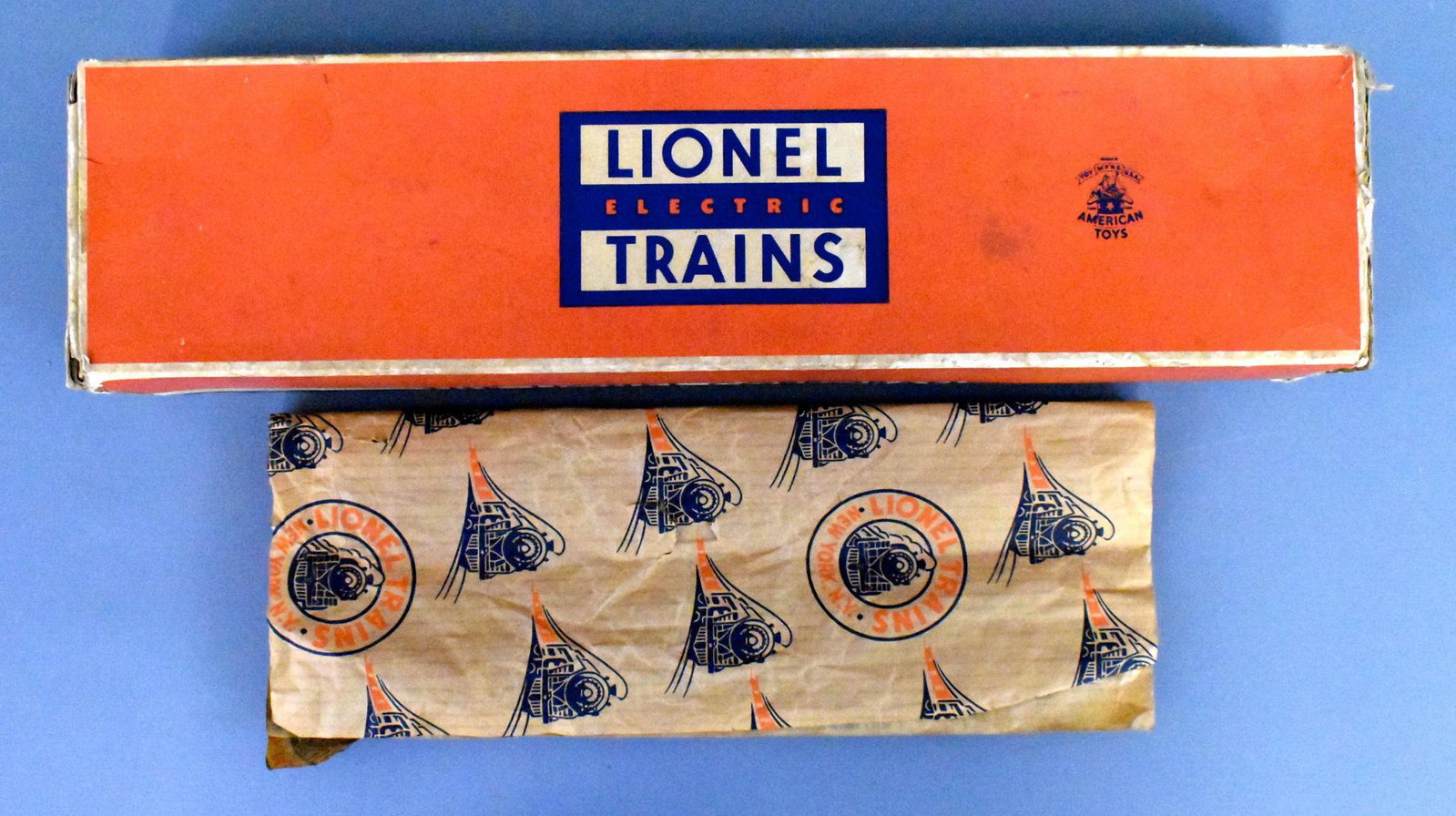 Lionel postwar O gauge 2337 Wabash GP-7 diesel: Scarce original box that is complete but has inner tape repairs on all flaps from one end. There is no insert with this box but is does come with a sheet of Lionel wrap that has some wear and measures