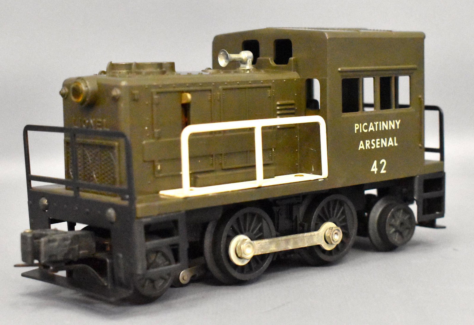 Lionel postwar O gauge 42 Picatinny Arsenal switcher: Unit has moderate run time and could use a detail cleaning but has all good window struts and no screw cracks , otherwise C6.