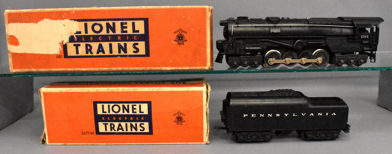 Lionel postwar O gauge 681 steam turbine & 2671WX: Locomotive is very clean with silver rubber stamped lettering and looks C6-7, tender is likely not original to the locomotive as it is a 2671WX with a Pennsylvania shell that has open holes on the bac