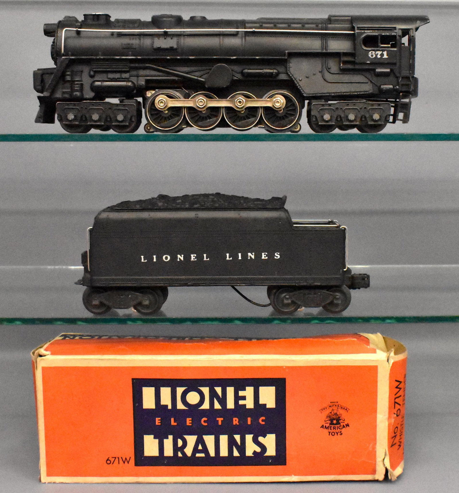 Lionel postwar O gauge 671 steam turbine with 671W: Locomotive and tender have heavy run time but were well cared for and are clean, C6. the 671W original box is missing the insert and is squashed but complete.