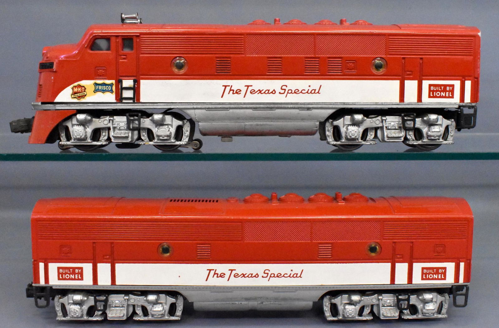 Lionel postwar O gauge 2245 MKT Texas Special F-3 AB: Both units have msome edge wear but atre otherwise complete and shiny, the powered unit has corrosion on some parts inside but none on the belly, C5.