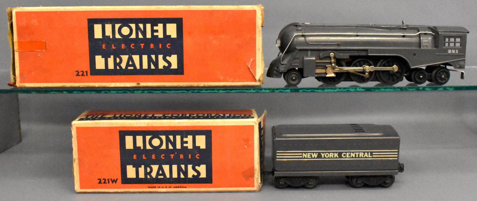 Lionel postwar O gauge 221 steam locomotive w/ 221W: Locomotive and tender are very clean with moderate run time and two worn original boxes with original inserts, C6-7.