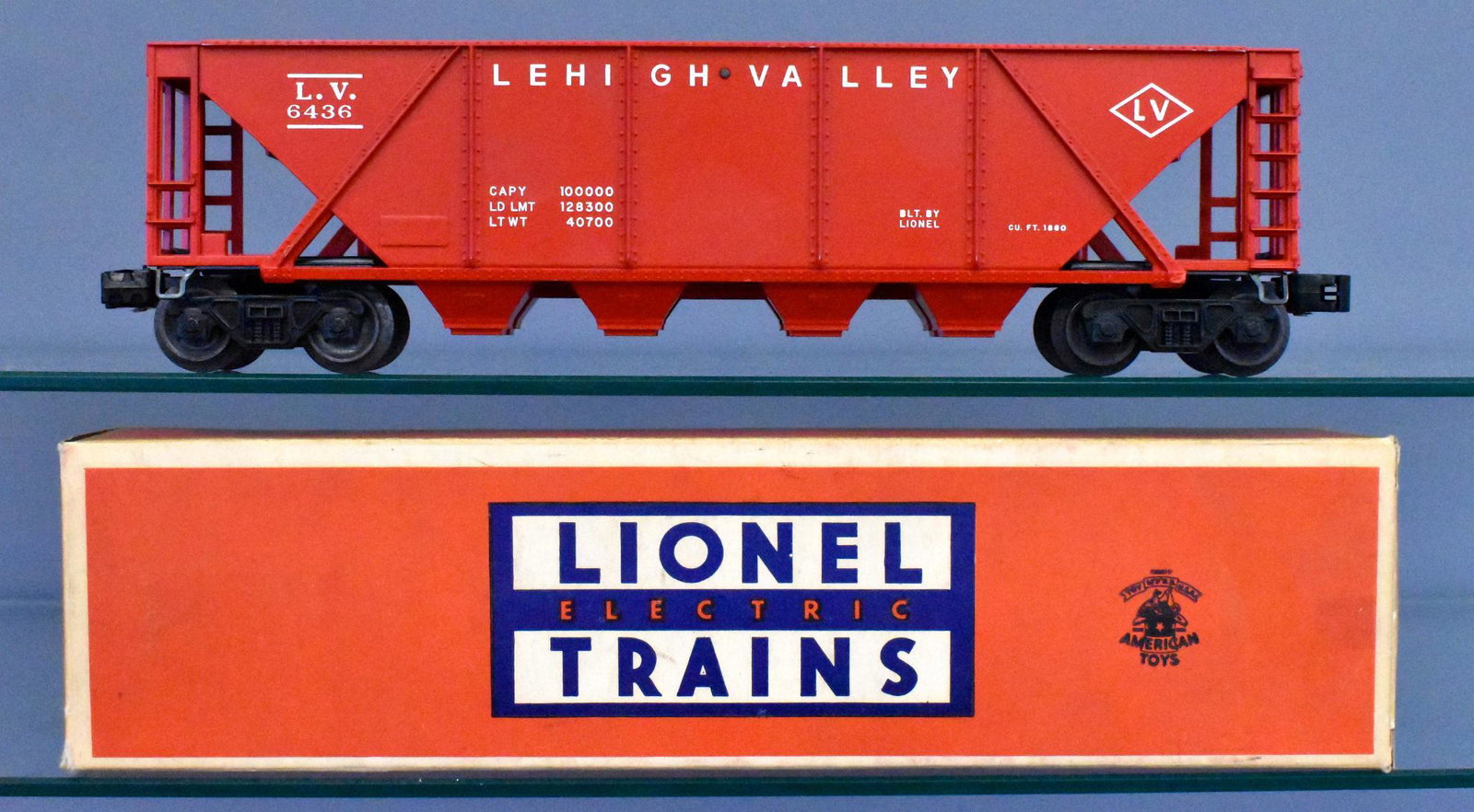 Unrun Lionel postwar O gauge 6436 red Lehigh Valley: Car is unrun and C9 with a couple very faint box rubs on raised edges. Comes in a complete, solid and square but incorrect original box with wear on one end flap.