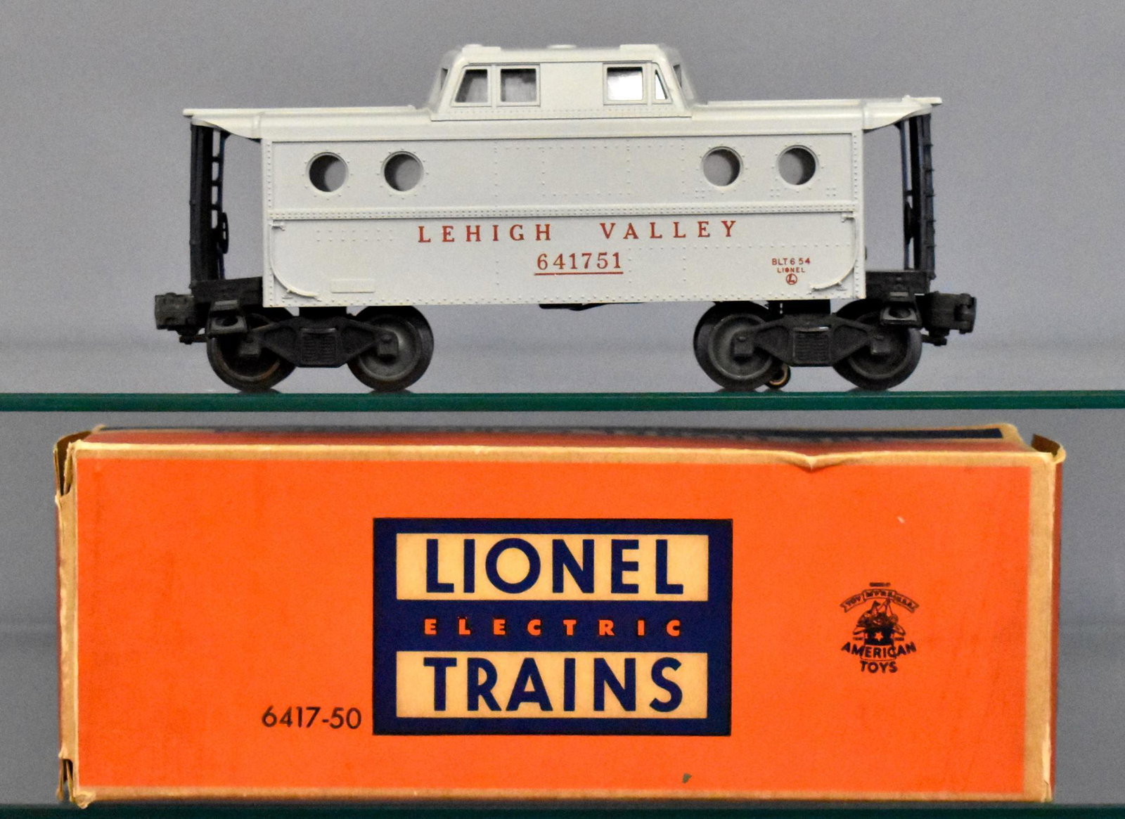 Lionel postwar O gauge 6417-50 Lehigh Valley porthole: Car is very nice and clean with light run time, C8+ in a complete correct original box with a few small seam splits.