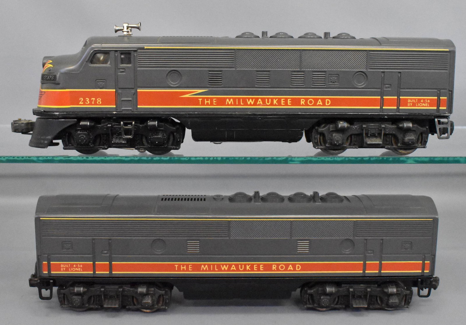 Counterfeit Lionel postwar 2378 Milwaukee Road F-3 AB: Both units are on painted gray shells with silk screened lettering, missing the detailed steps and door on the front of the A unit. The A unit frame appears to be a correct original but the B unit fra