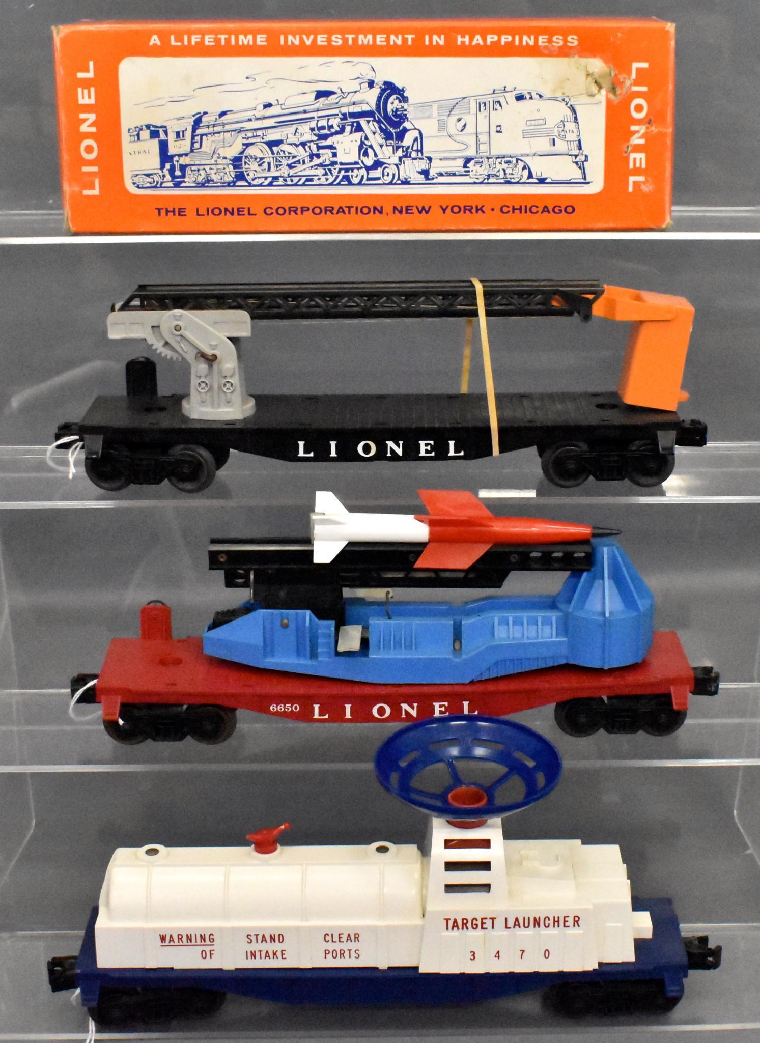 Lionel postwar O gauge military and space cars 6512: Includes 3470 aerial target launching car with a damaged anemometer that can easily be removed, 6512 cherry picker car w/ original box and crisp original instruction sheet and 6650 missile firing flat