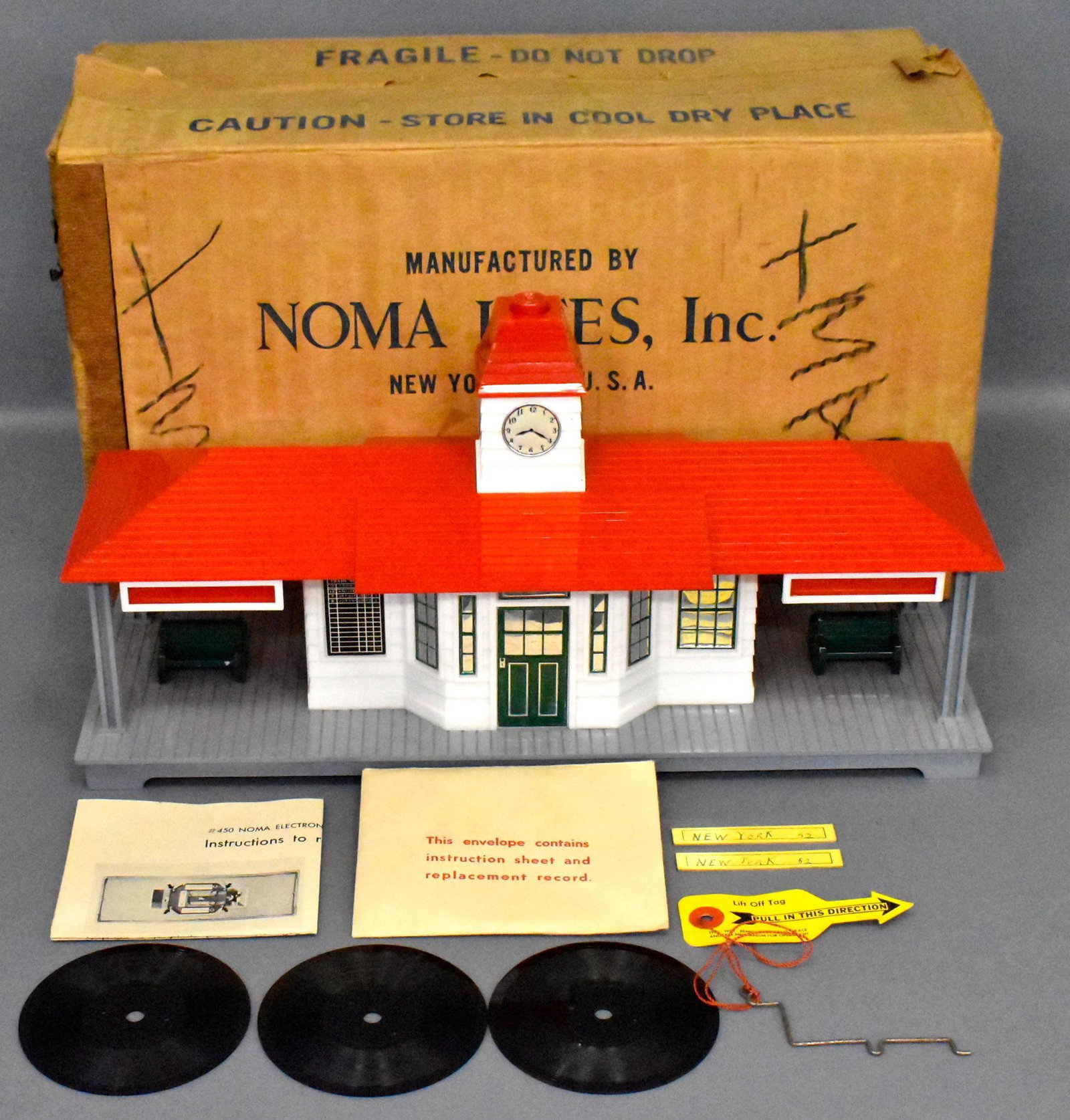 Noma Talking Station in original box with extra records: Nice piece that is extraordinarily clean, appears to have been used little, if at all. All clock stickers are in place, comes with three extra records, original instruction sheet and envelope, origina