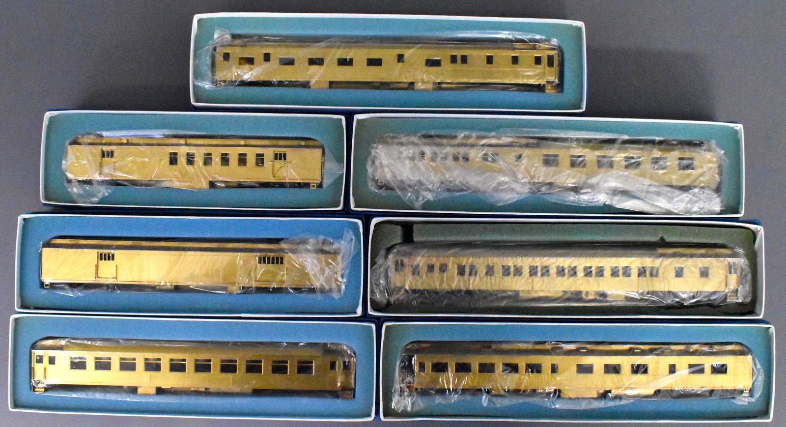 Seven Lambert HO scale brass heavyweight passenger cars: INCLUDES RPO, baggage, diner, coach, lounge, Pullman and observation cars C9-10 in near mint original boxes with original foam inserts, original paperwork and extra parts.