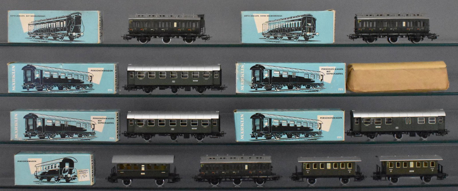 Ten Marklin HO gauge passenger cars in original boxes: Includes two 4079 and two 4080 coaches (one still factory wrapped), 4000 coach, two 4004, one 4005 and two 4040 tin coches with some spotty oxidation on the roofs, all trains in this group are otherwi