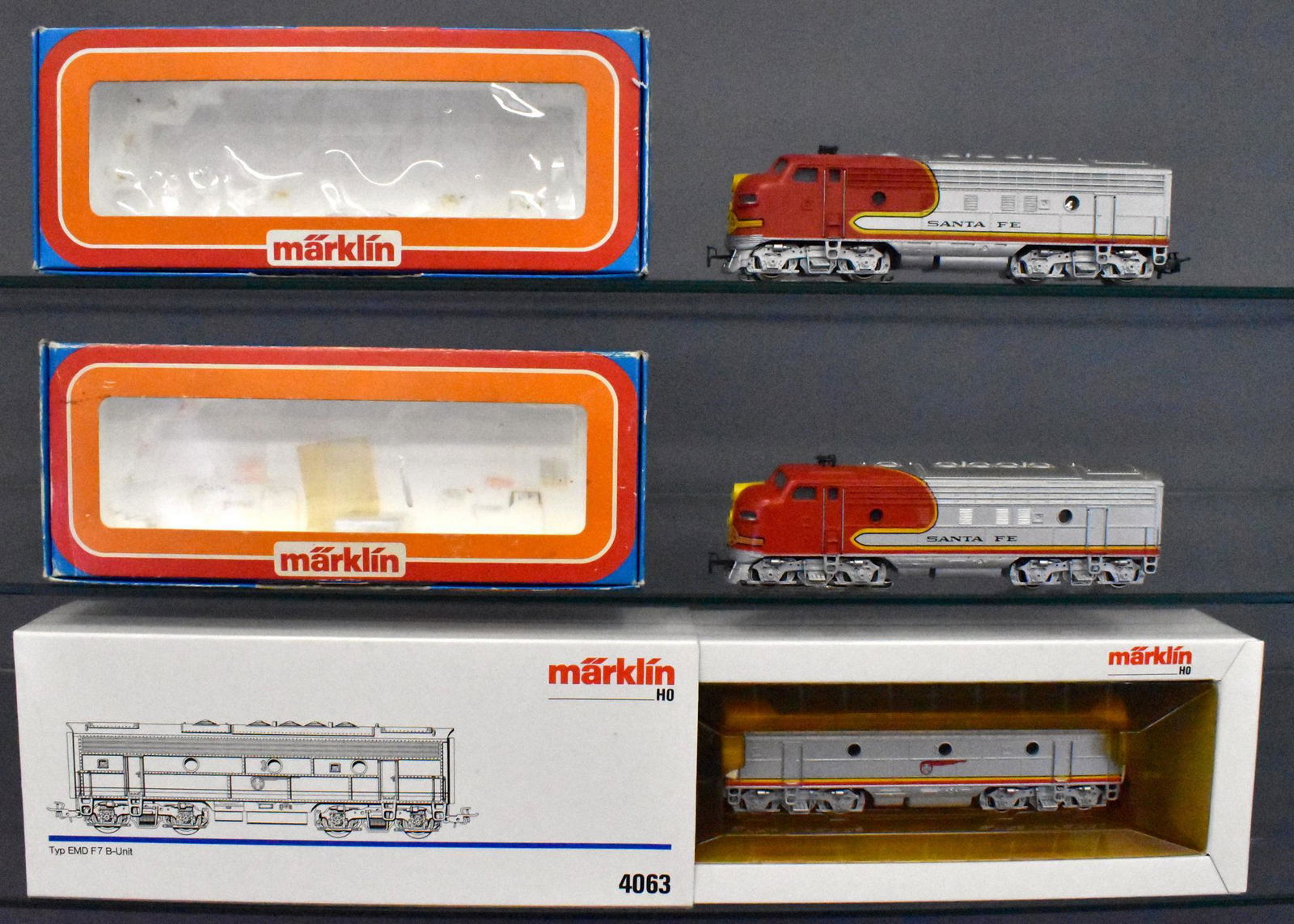 Marklin HO gauge Santa Fe F-7 diesel locomotive ABA set: Includes 3060 powered A unit, 4060 non-powered A unit and 4063 non-powered B unit, all with little to no run time and C8 in fair to excellent original boxes.
