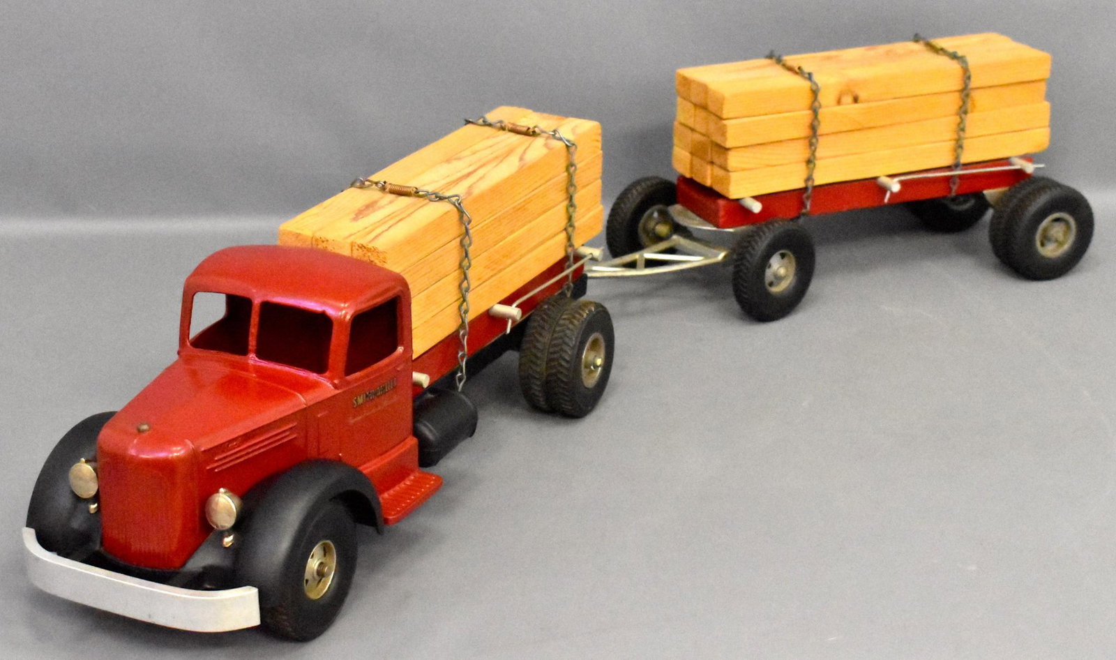 Repainted Smith Miller L Mack lumber truck with pup: Repainted Smith Miller L Mack lumber truck with pup trailer. Truck has been repainted in red and black but has original loads as seen in the photos.