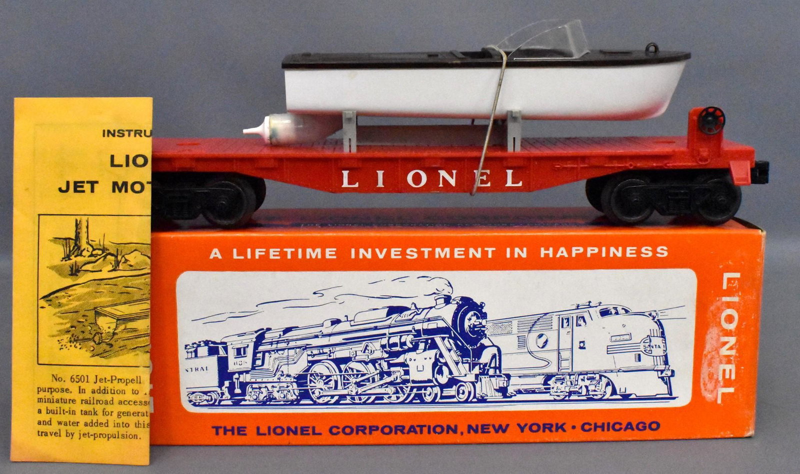 Lionel postwar O gauge 6501 jet motor bot flat car in: Lionel postwar O gauge 6501 jet motor bot flat car in original box. Car shows light run time but is otherwise a C8 car with C7 boat due to a cracked nozzle. Comes with with a crisp original instructio