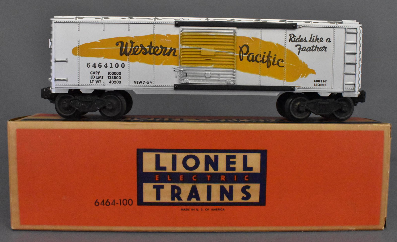 Lionel postwar O gauge 6464-100 Western Pacific box car: Lionel postwar O gauge 6464-100 Western Pacific box car in original box. Car is a type IIa and has very light run time and is C7+ in a brick original box.