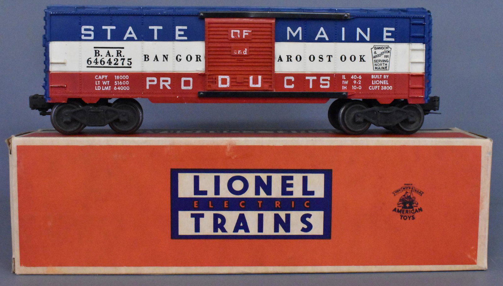 Lionel postwar O gauge 6464-275 State of Maine box car: Lionel postwar O gauge 6464-275 State of Maine box car in original box. Car is a type IIa body, painted red and blue on a white body mold with grooves and a red door, C6+ with a brick original box tha