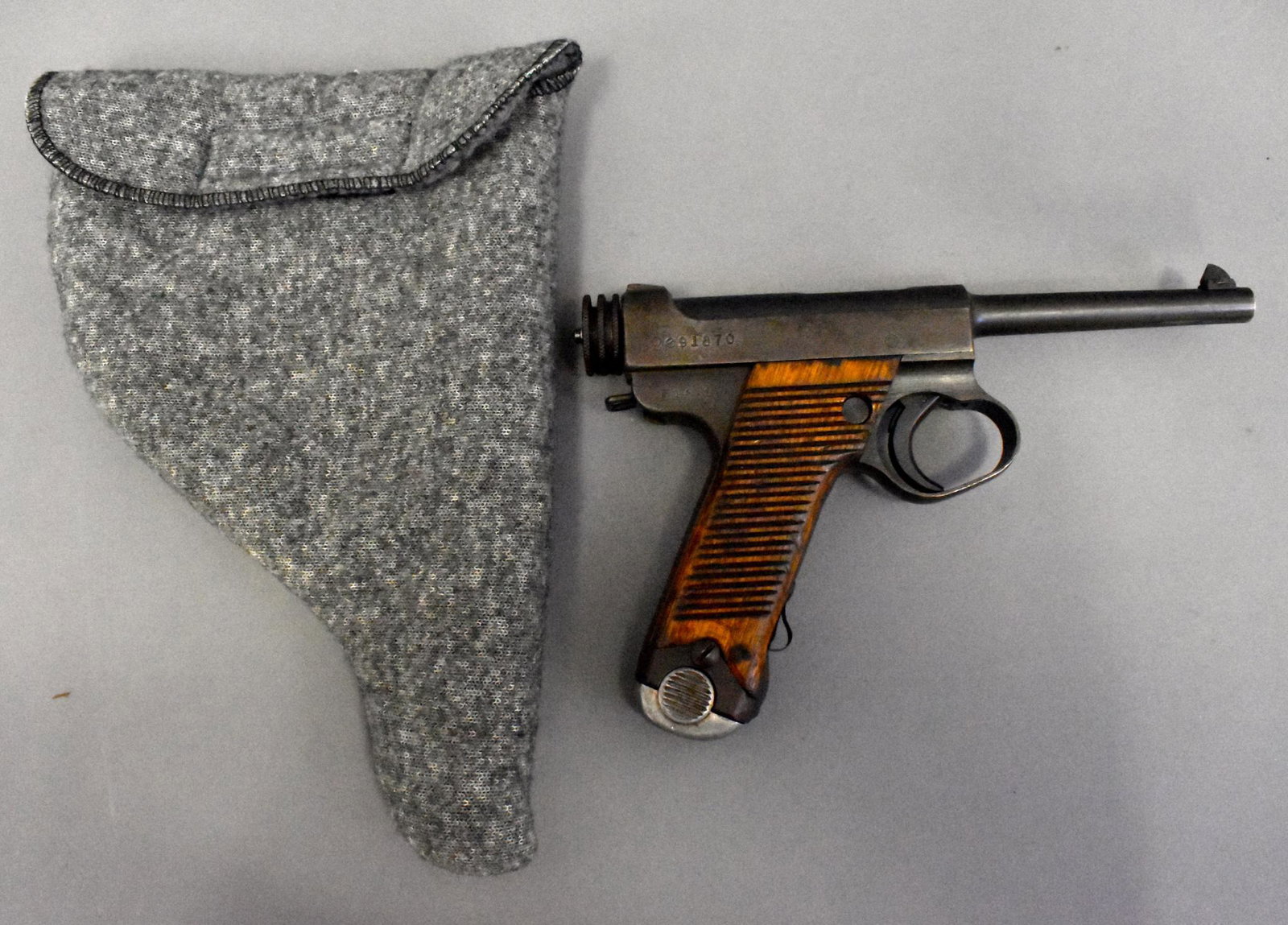 WWII Japanese Type 14 Nambu 8mm pistol Nagoya 1st: WWII Japanese Type 14 Nambu 8mm Nagoya Arsenal 1st Series 18.9 date Sept 1943 all matching except magazine. Excellent bore. Overall excellent with metal surfaces turning plum and brown. Transfer or FF