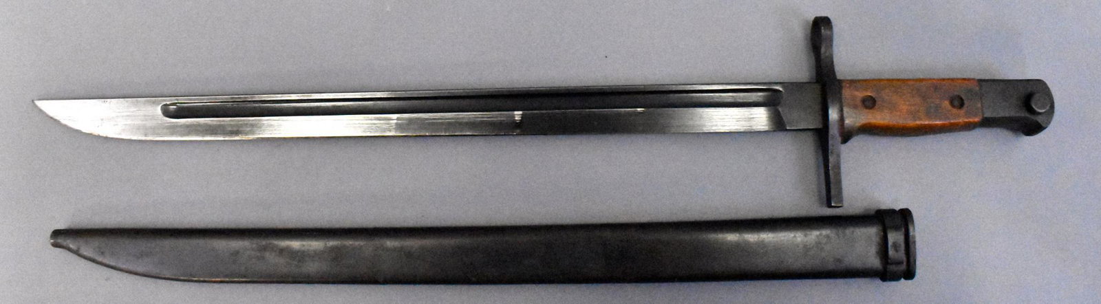 WWII Japanese Type 30 Bayonet & scabbard for Arisaka: WWII Japanese Type 30 Bayonet and scabbard for Arisaka Rifle. Matsushita made, blued blade. Nice overall with excellent blade. Nice scabbard with very minor surface corrosion. Labar book type LB-109.