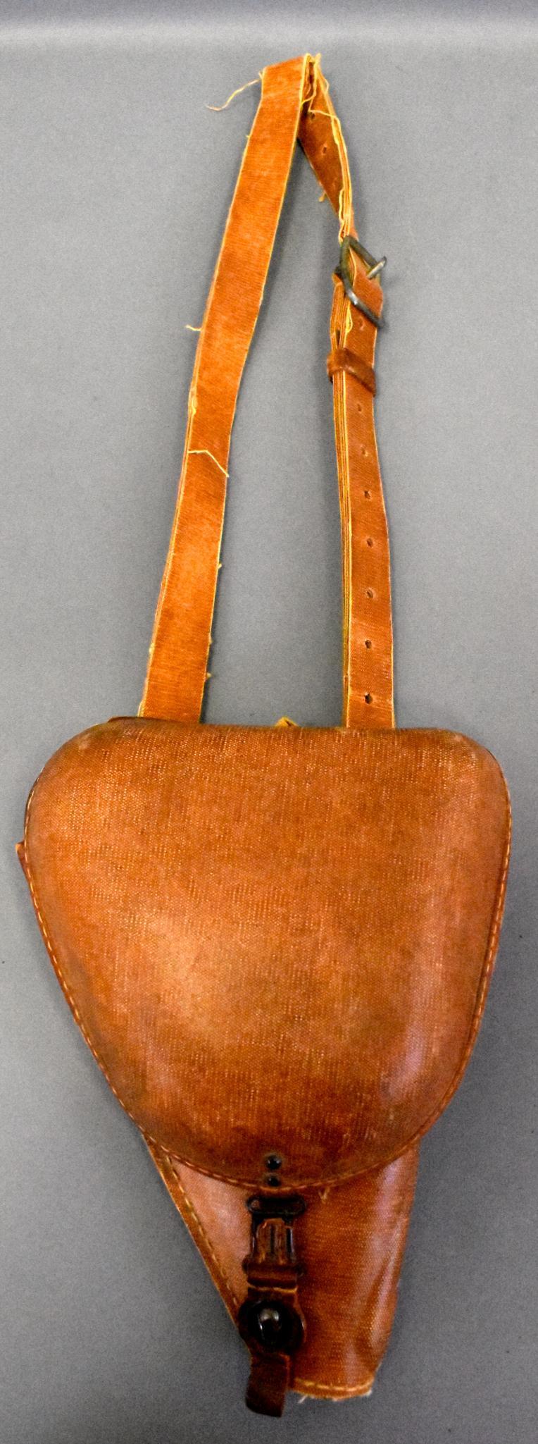 WWII Japanese military Type 14 Nambu rubberized canvas: WWII Japanese military Army Type 14 Nambu rubberized canvas pistol holster Type 9 with shoulder strap. Bring back tag and veteran marked Staff Sgt Gerald Keizea Co. ? 82nd Excellent condition.