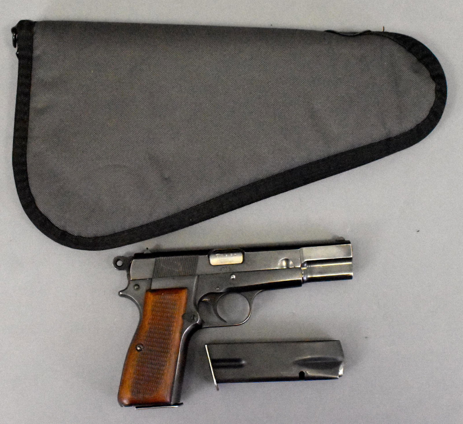 FN P35 P-35 Browning HiPower 9mm semiautomatic pistol: FN Fabrique Nationale D Armes P35 P-35 Browning HiPower 9mm semiautomatic pistol. Scare 1950s Austrian Police contract. Four digit serial number marked LGKK 0371 on front strap and magazine. Excellent
